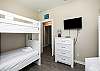 Third bedroom on the second floor with two sets of twin size bunk beds and flat screen TV