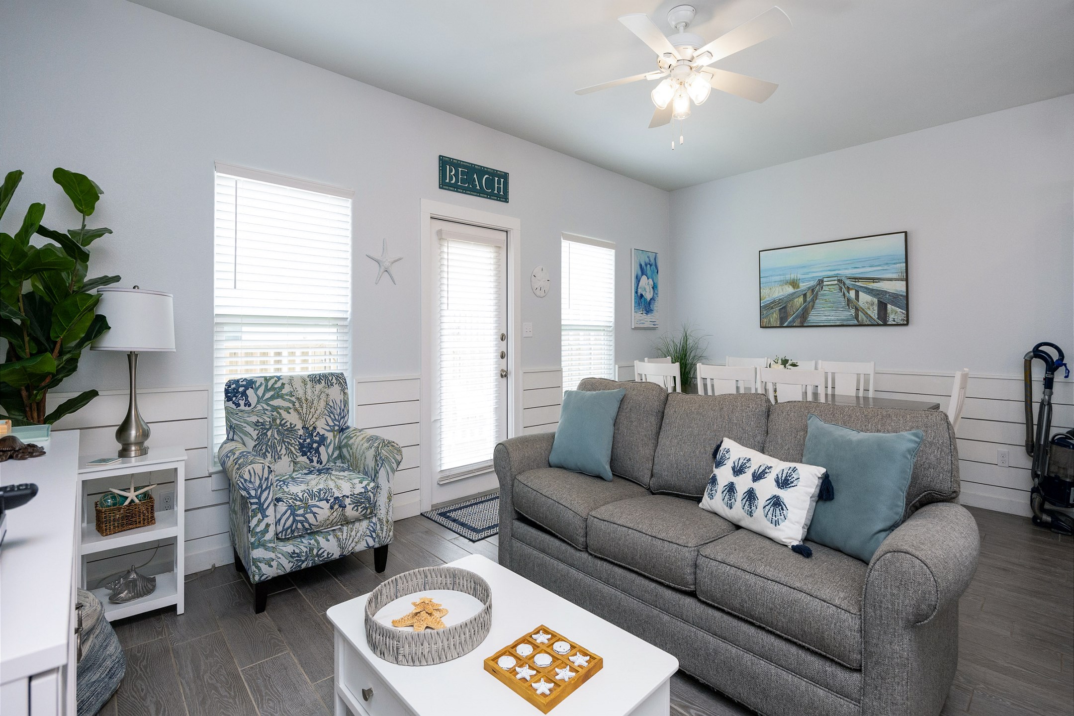 Charming living area with access to the back patio 