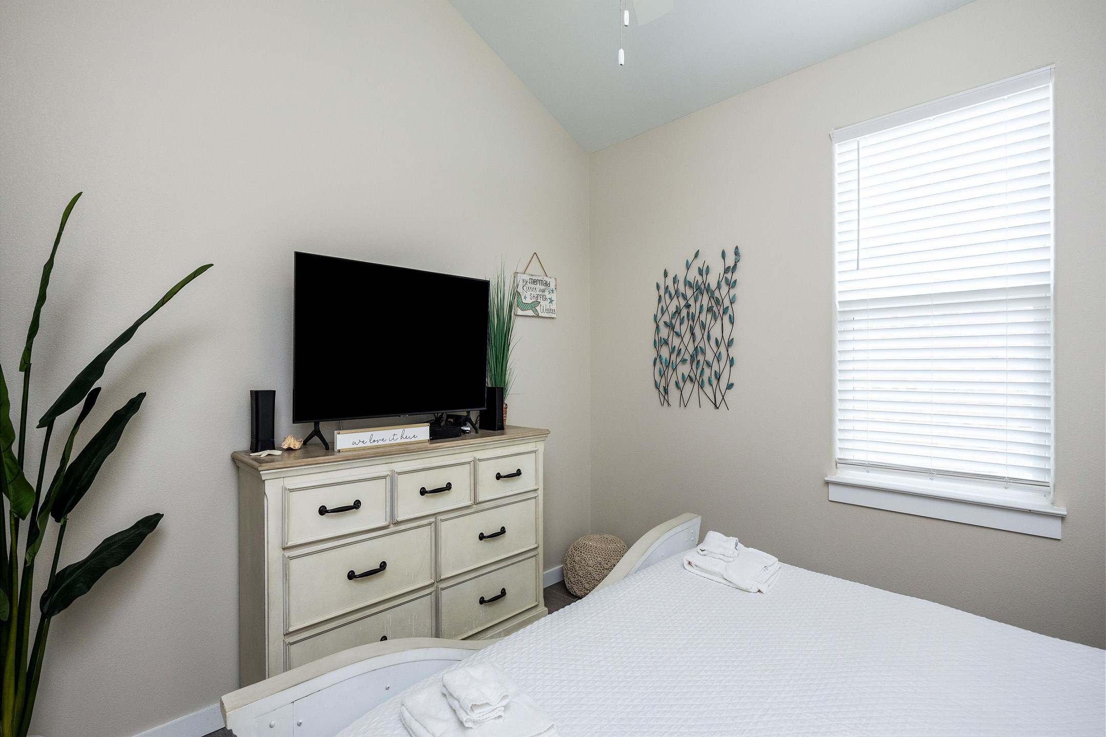 Enjoy the convenience of a spacious dresser for your clothes and a flat screen TV to unwind with your favorite shows after a day of fun.