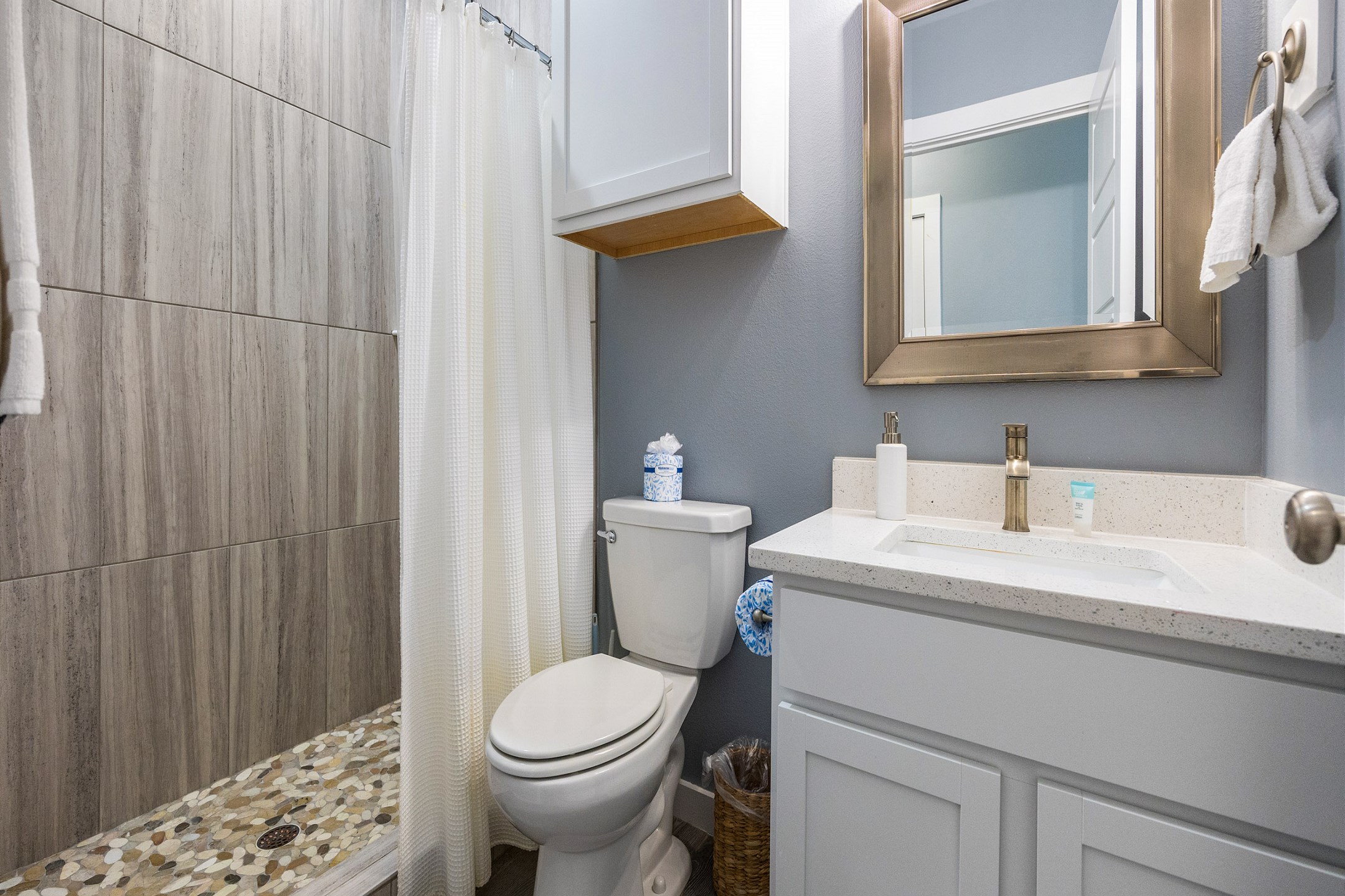 Master bathroom on the second floor with sink, toilet, and walk-in shower 