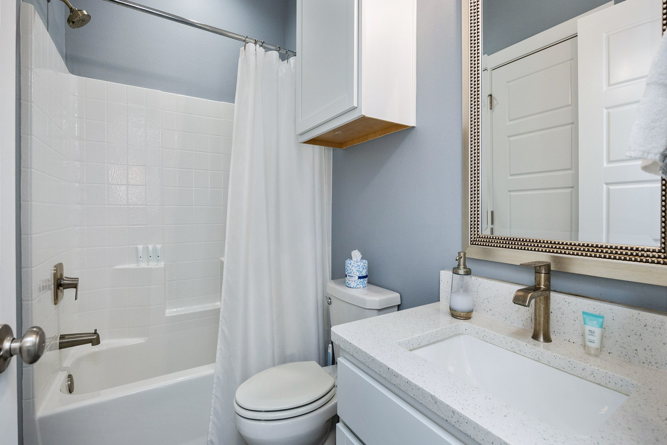 Guest bathroom on the second floor with sink, toilet, and a tub/shower combo 