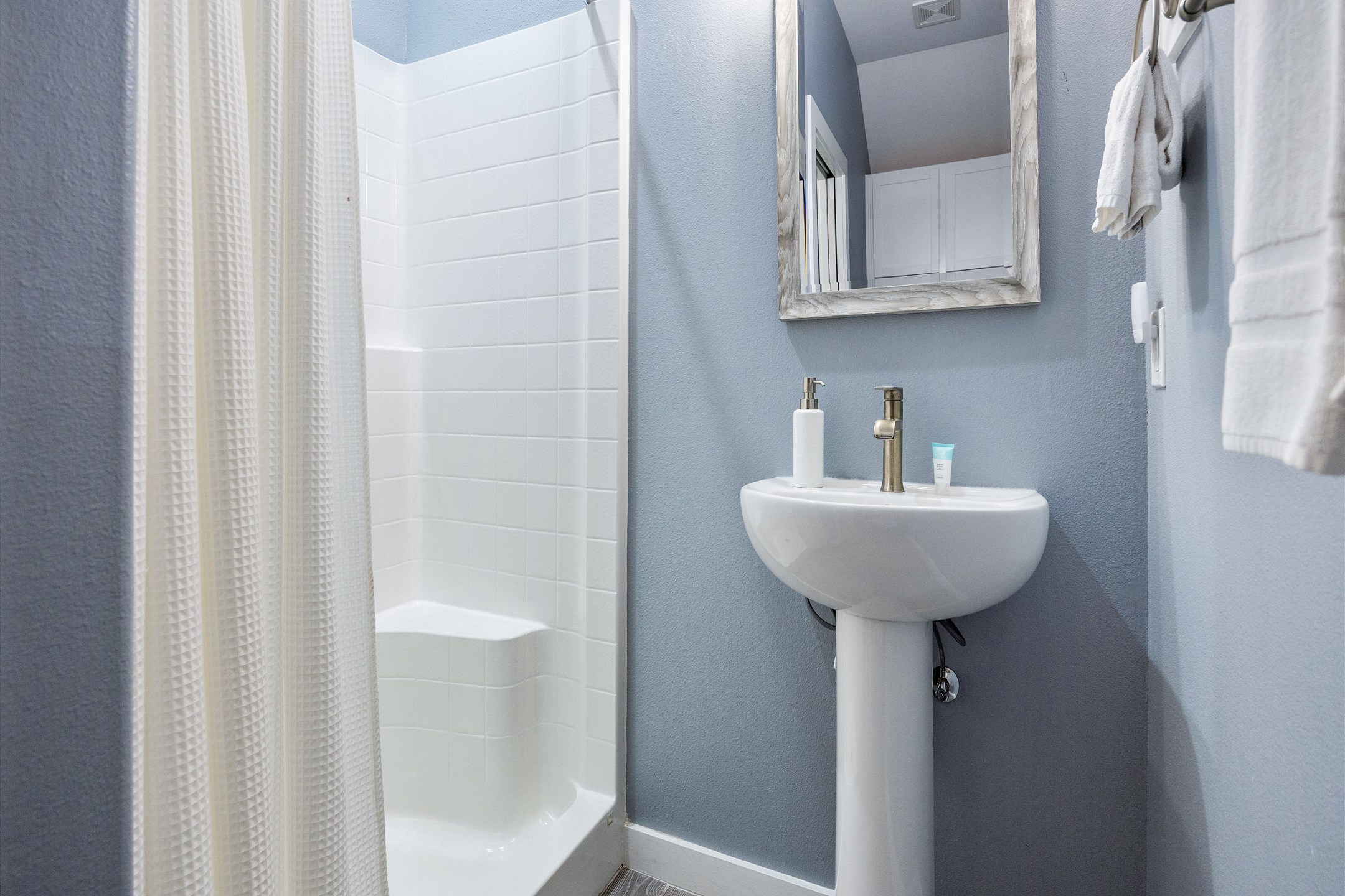 Guest bathroom on the first floor with walk in shower 