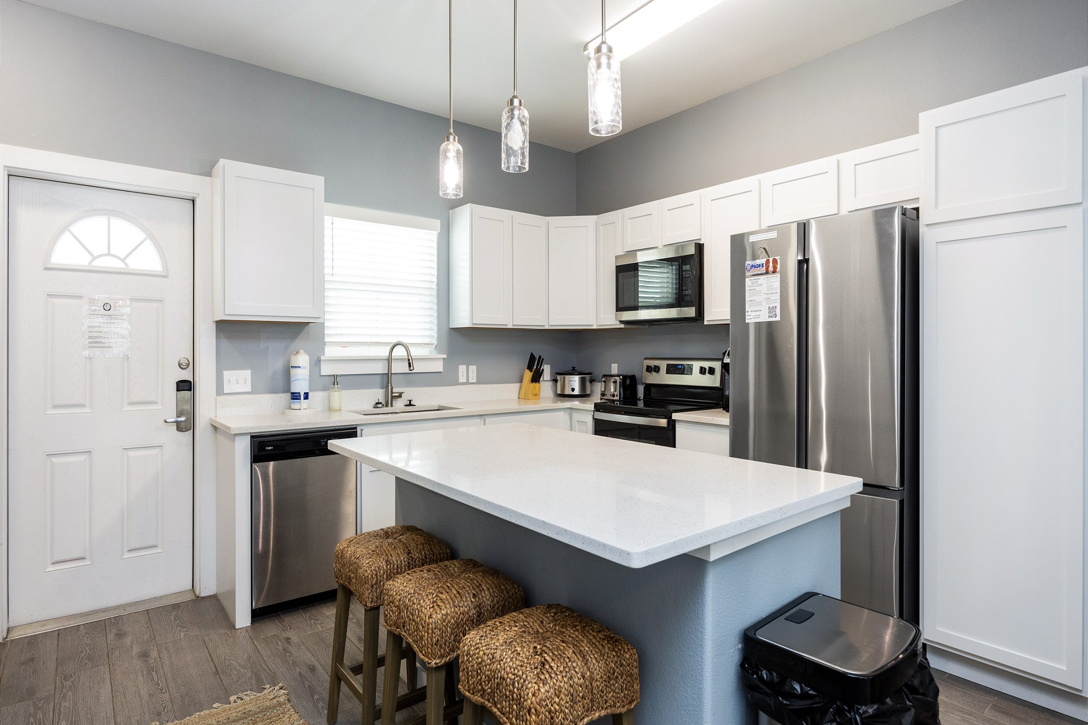 Chic kitchen featuring marble countertops and an expansive layout ideal for cooking and dining