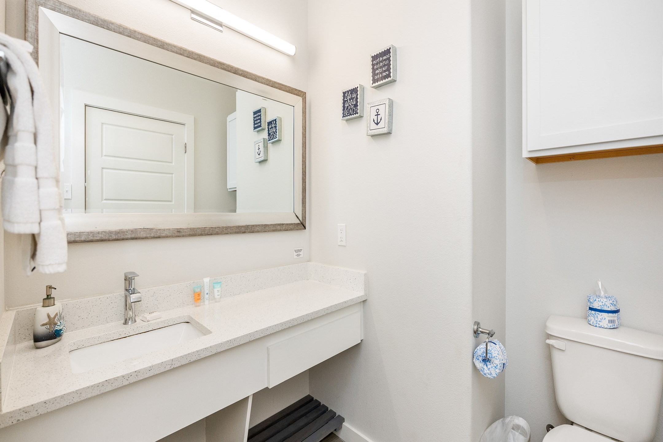 Full bathroom with single sink, toilet, and walk-in shower