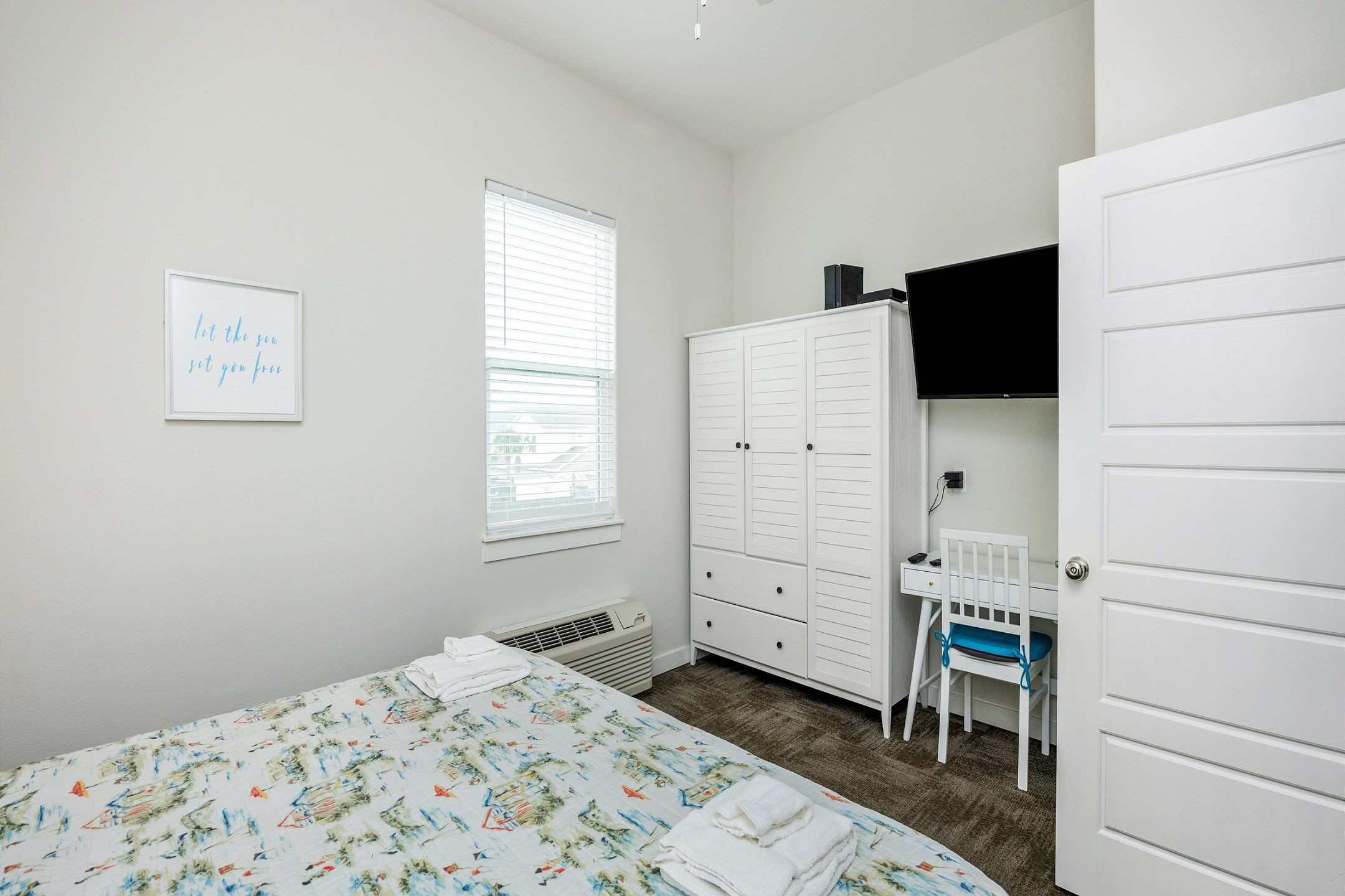 Charming master bedroom with king size bed and flat screen TV