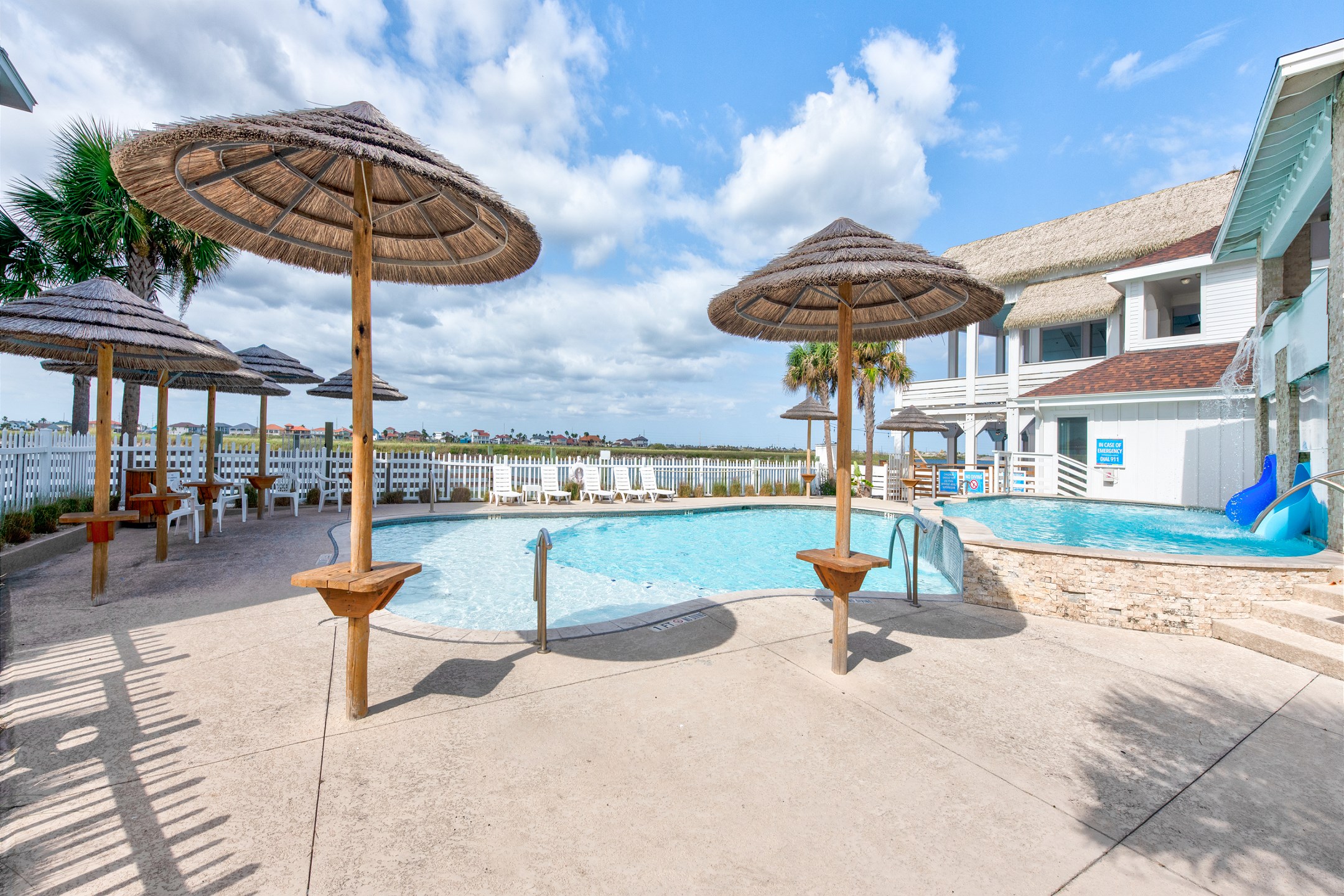 The sparkling Aruba Bay Resort pool overlooks the canal, offering a picturesque backdrop