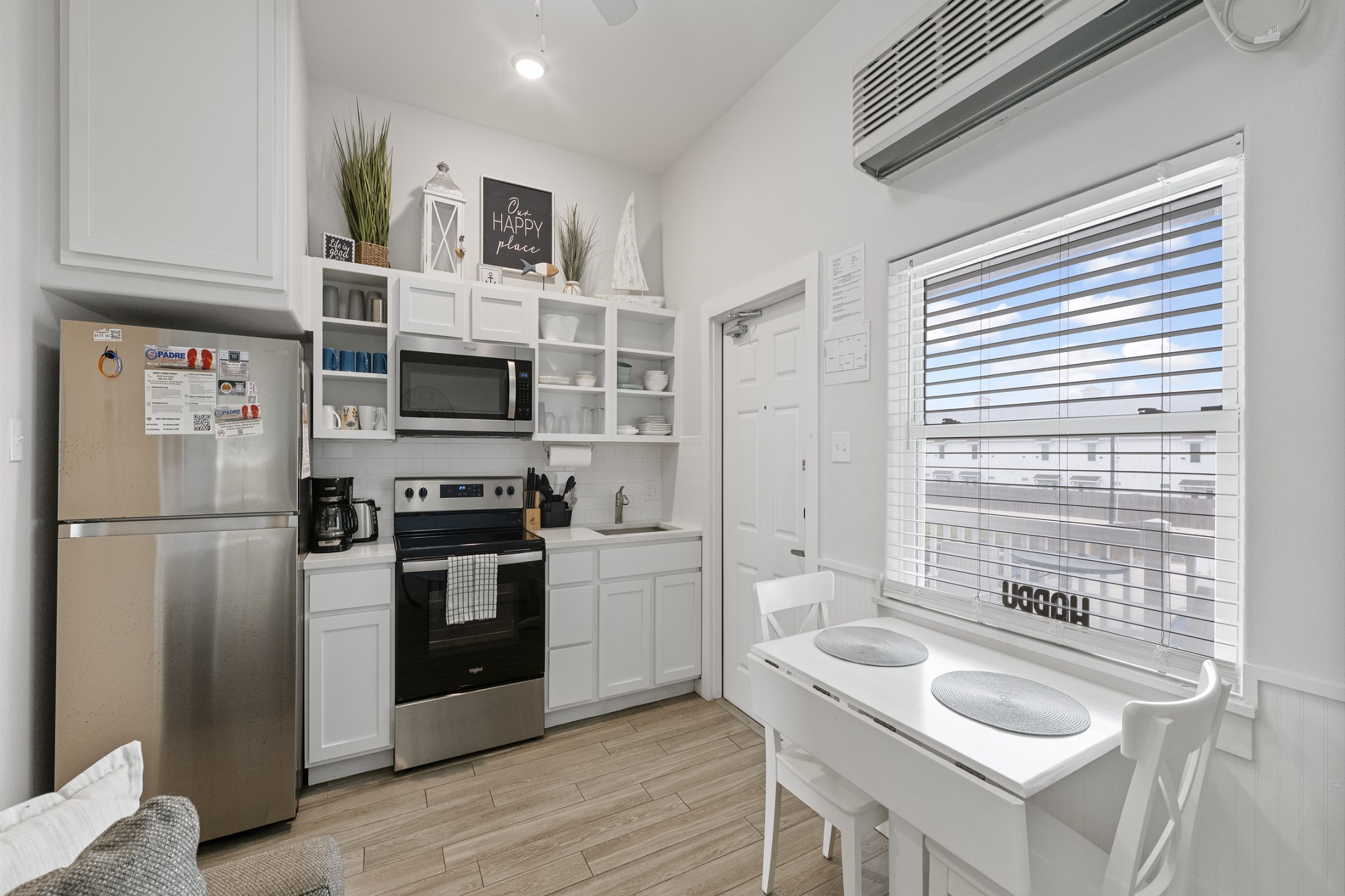 Kitchen and dining area with seating for two