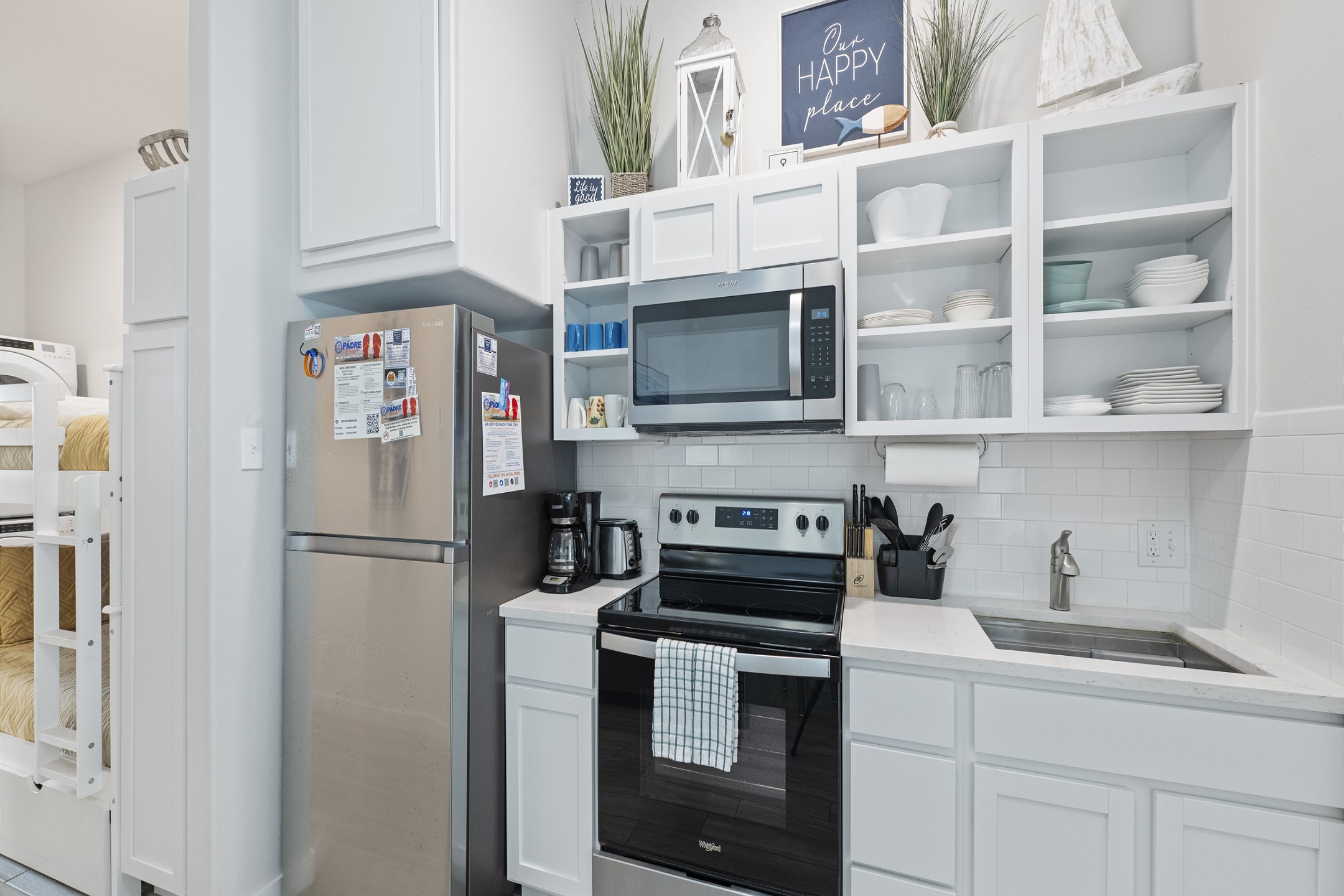 Kitchen area with stainless steel appliances 