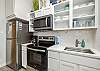 Kitchen area with stainless steel appliances 