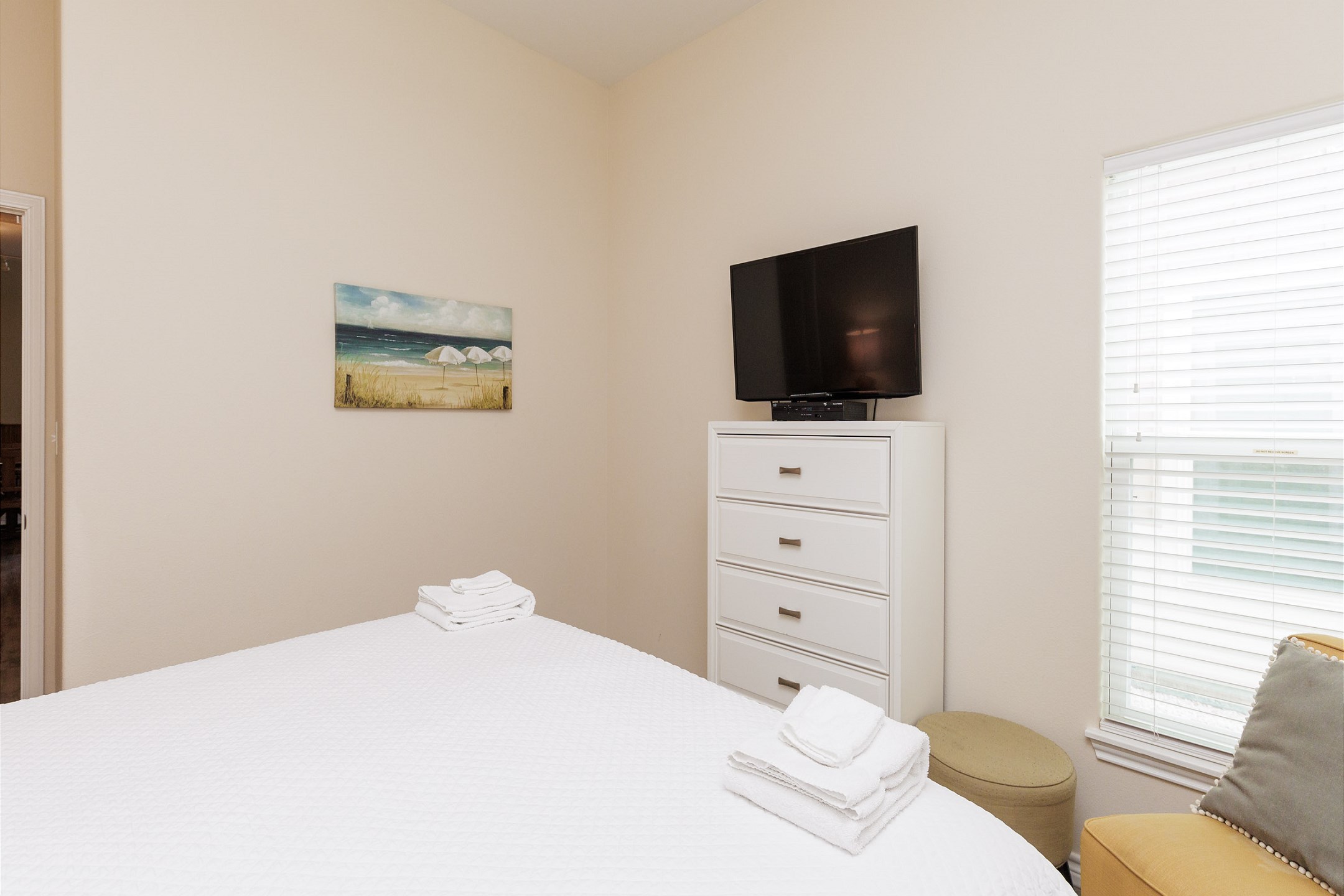 Master bedroom with king size bed, private bathroom and flat screen TV