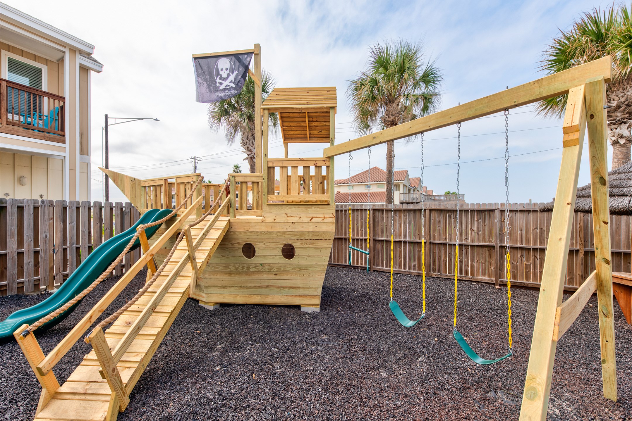 The ultimate family-friendly feature: a playground with swings, slides, and a pirate ship design—perfect for keeping the kids entertained!