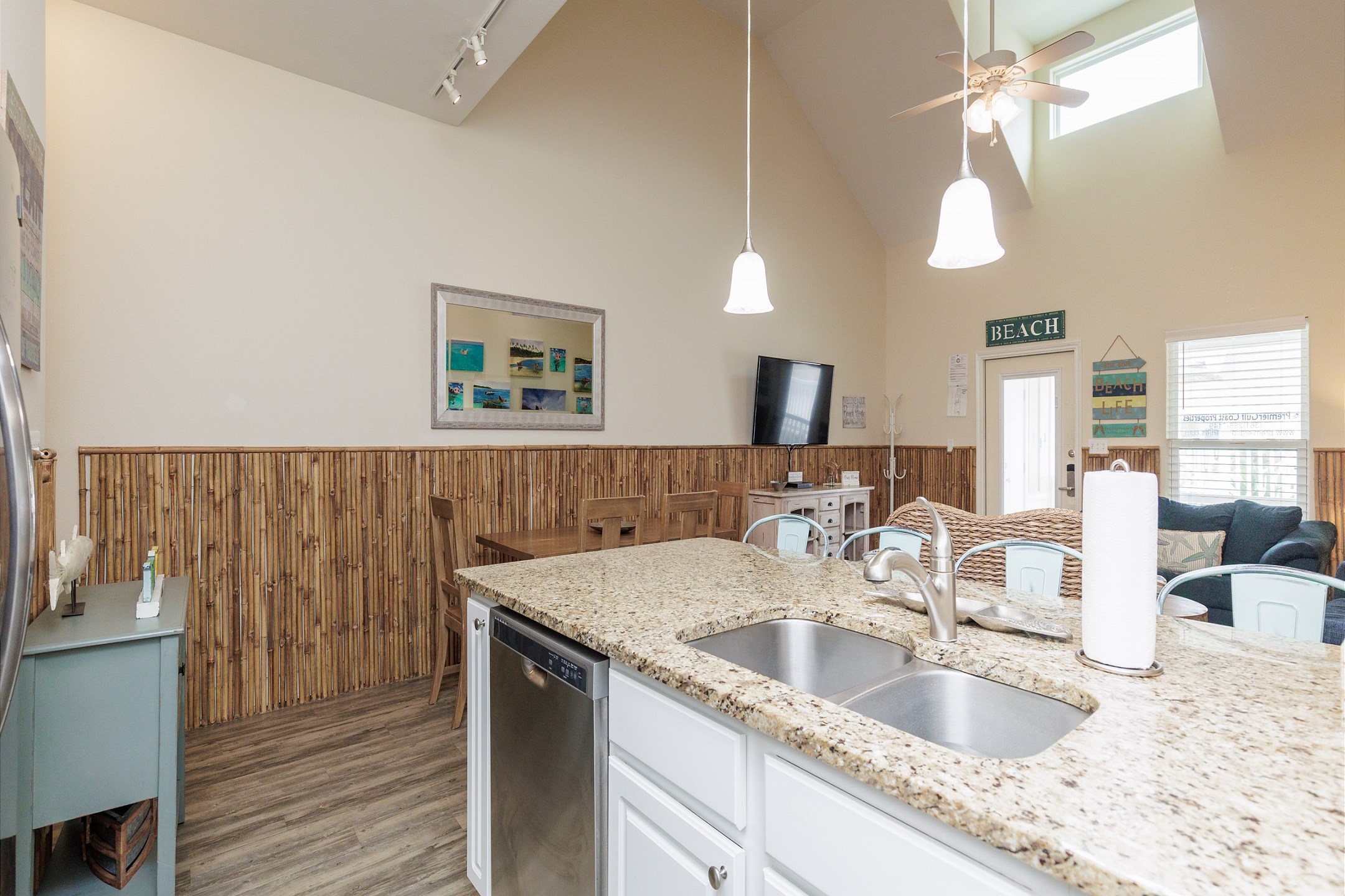Fully equipped kitchen with cookware, utensils, and dinnerware for guest use