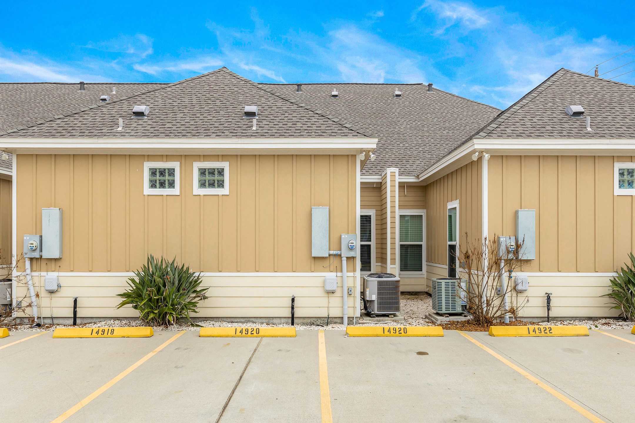 Two reserved parking spaces behind townhome
