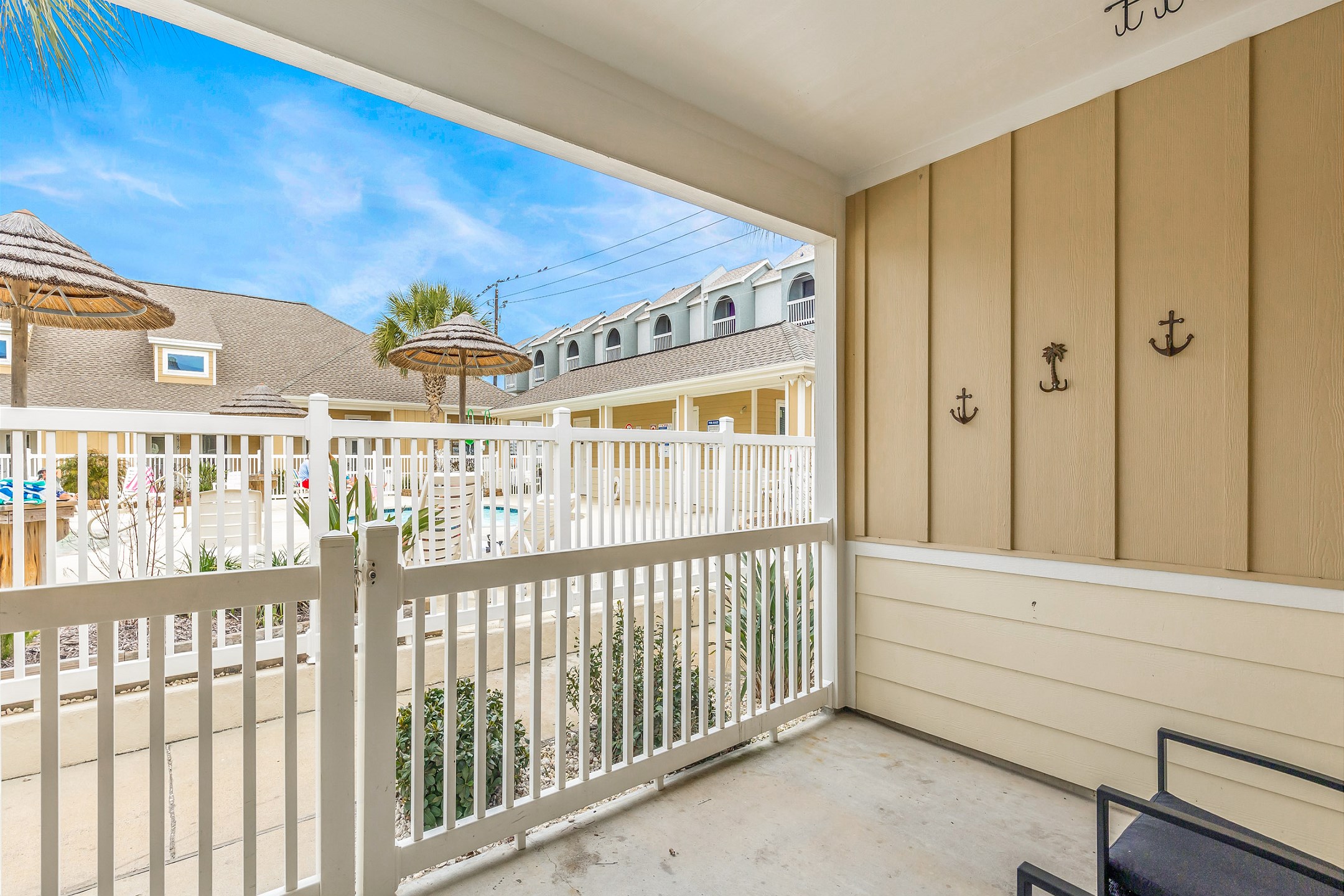 Enjoy a private patio with a view of the pool