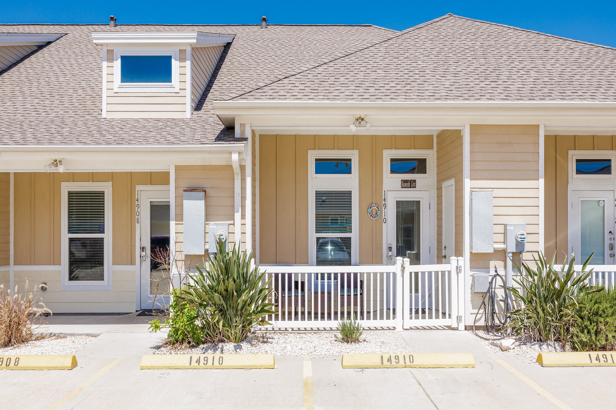 Front door entrance and two reserved parking spots 