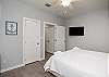 Master bedroom on the first floor with king size bed, private bathroom and flat screen TV