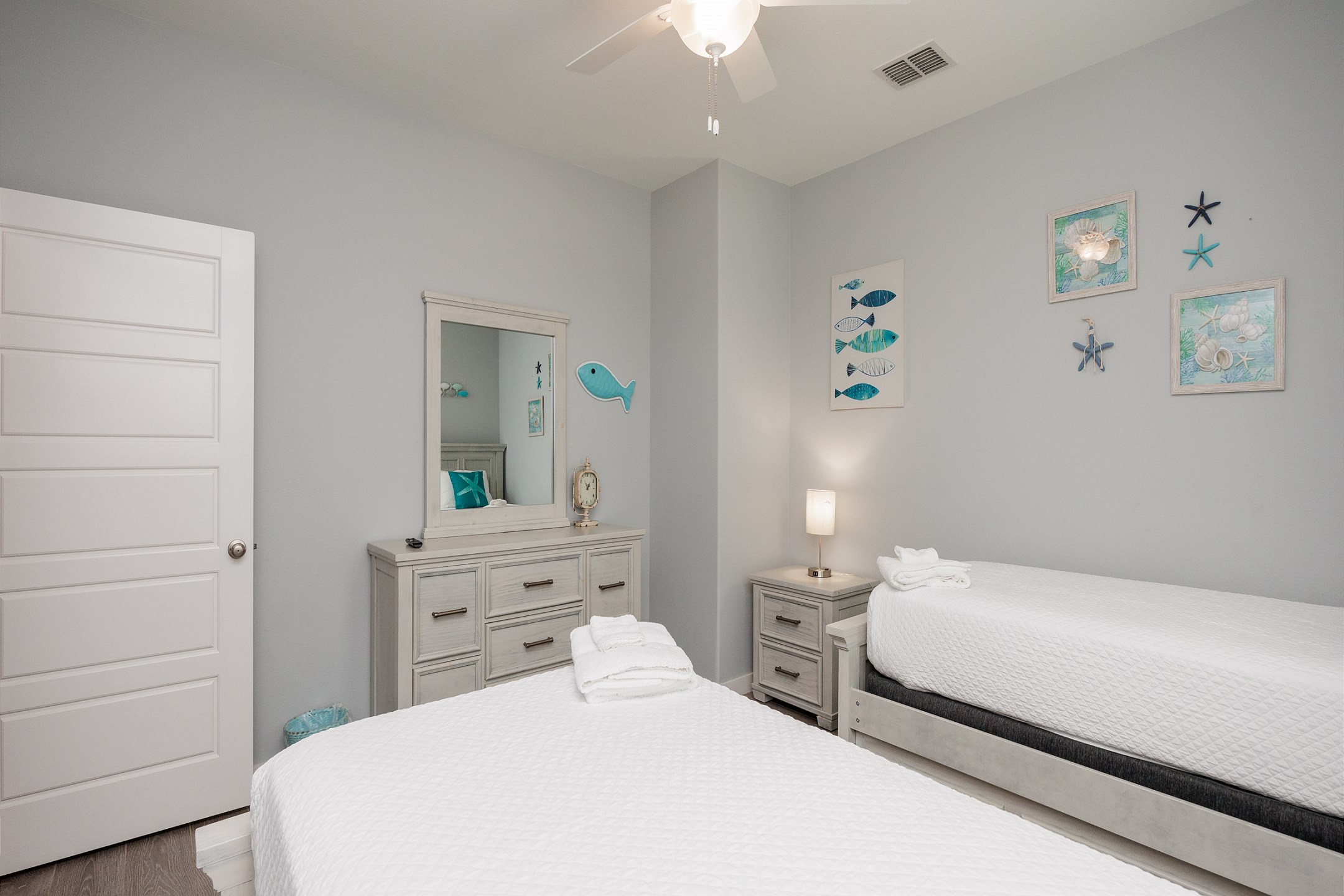 Second bedroom on the second floor with two twin size beds and a twin trundle, along with a flat screen TV