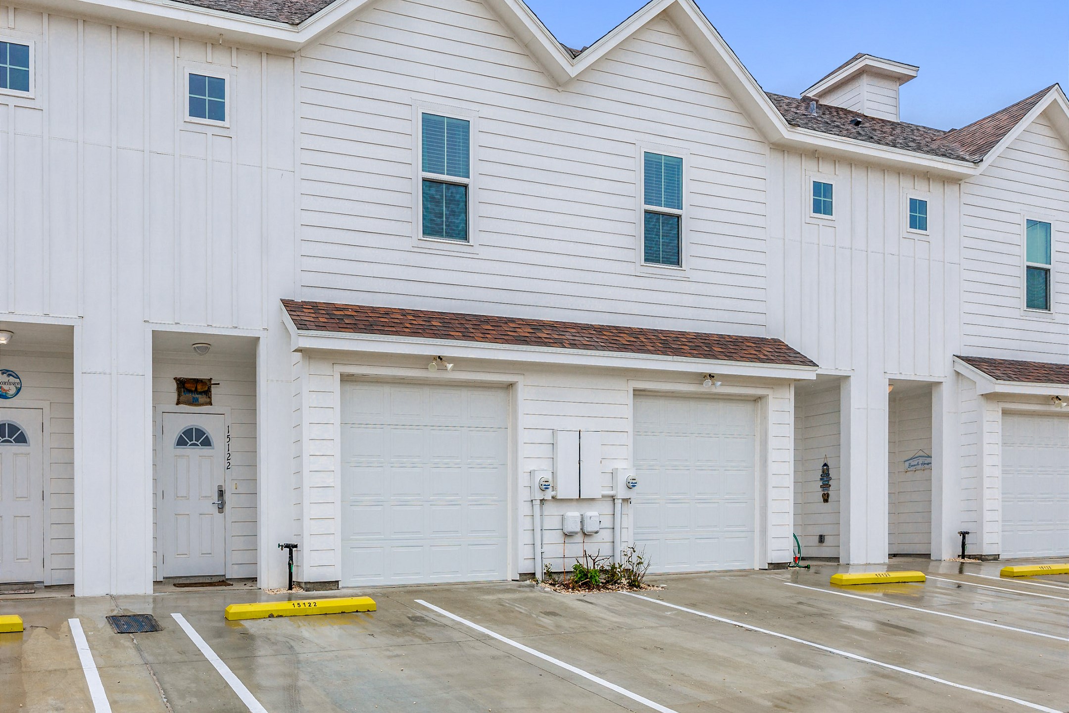 Front view of property with reserved parking spots