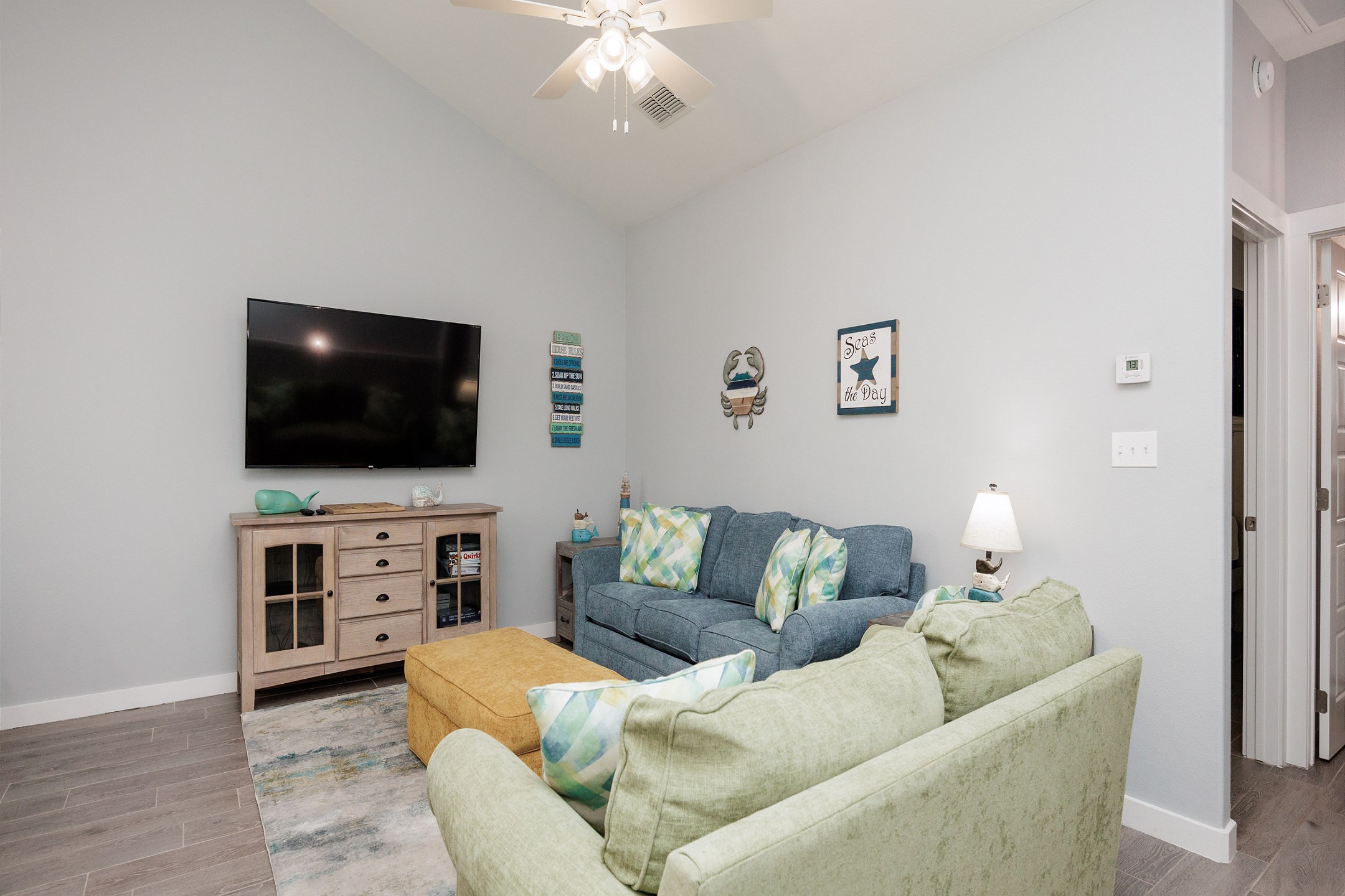 Comfortable living area featuring a queen-size sleeper sofa and a flat-screen TV for your entertainment