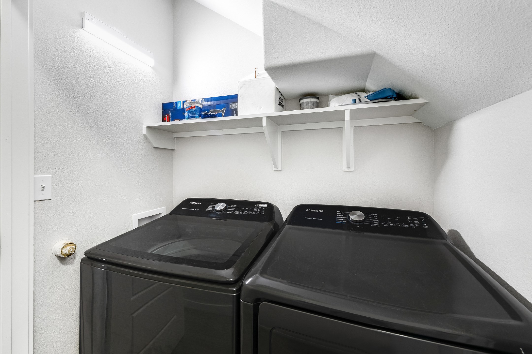 Washer and dryer located in first floor hallway 