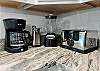 Fully stocked kitchen with blender, coffee maker, and toaster 