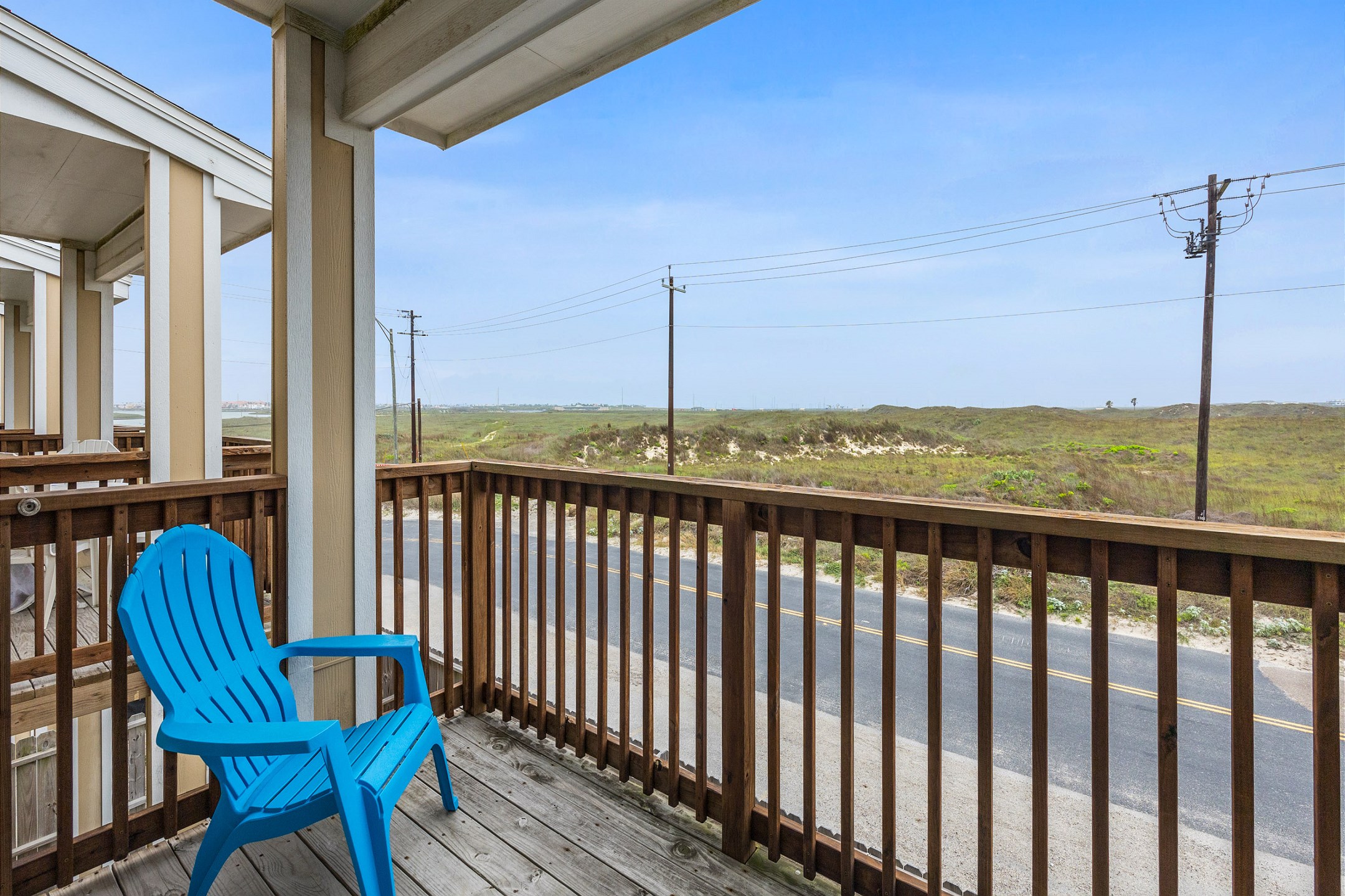 Second floor balcony with a beautiful view of the beach in the distance 
