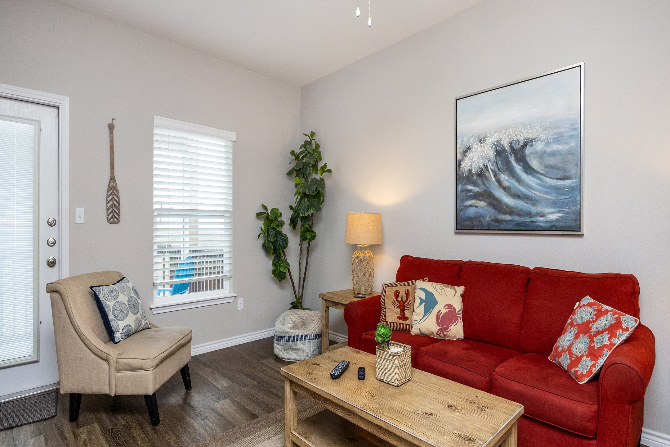 Beautiful living area with access to a private balcony and flat screen TV