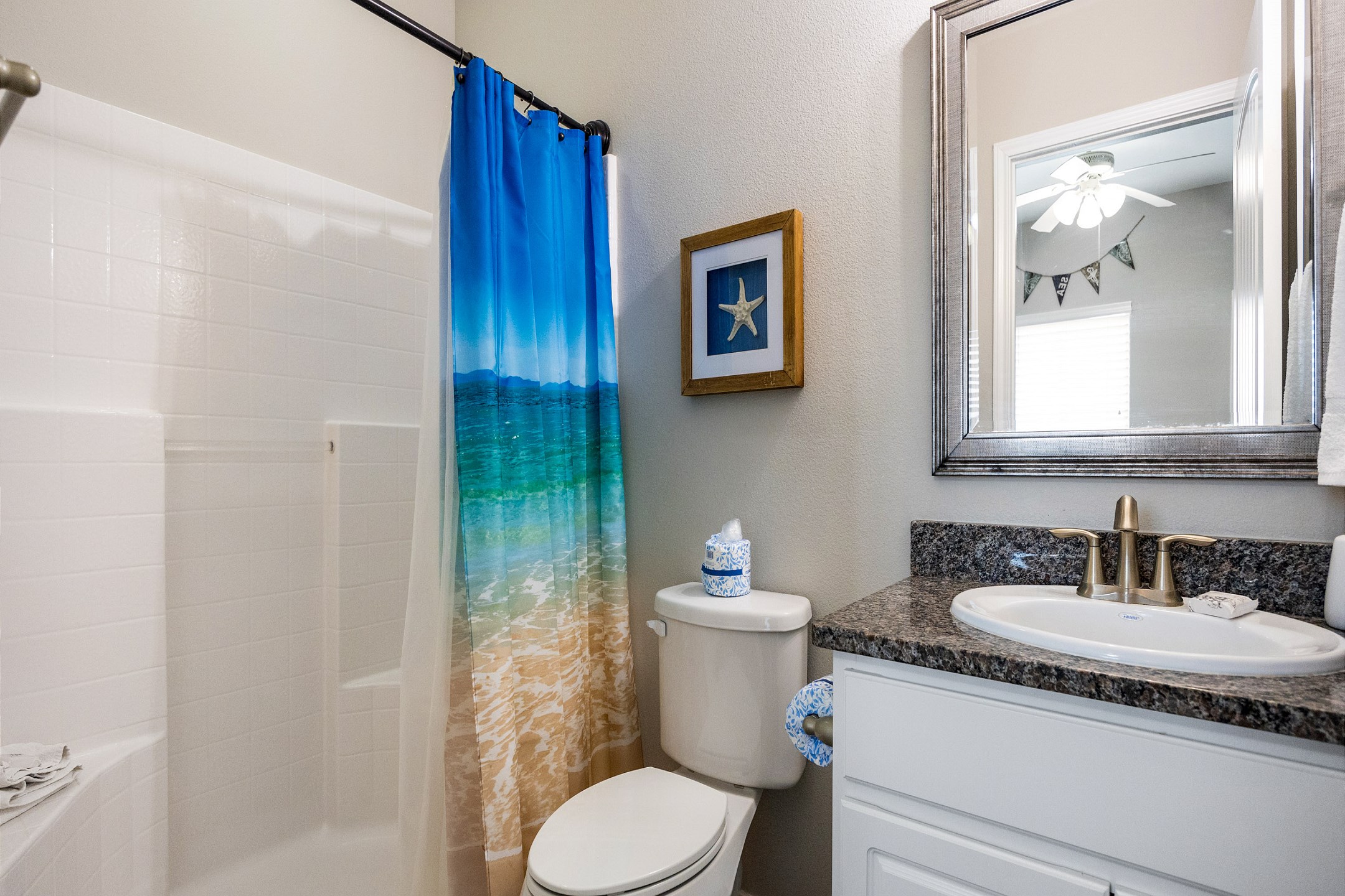 Master bathroom on the first floor with sink and walk in shower 