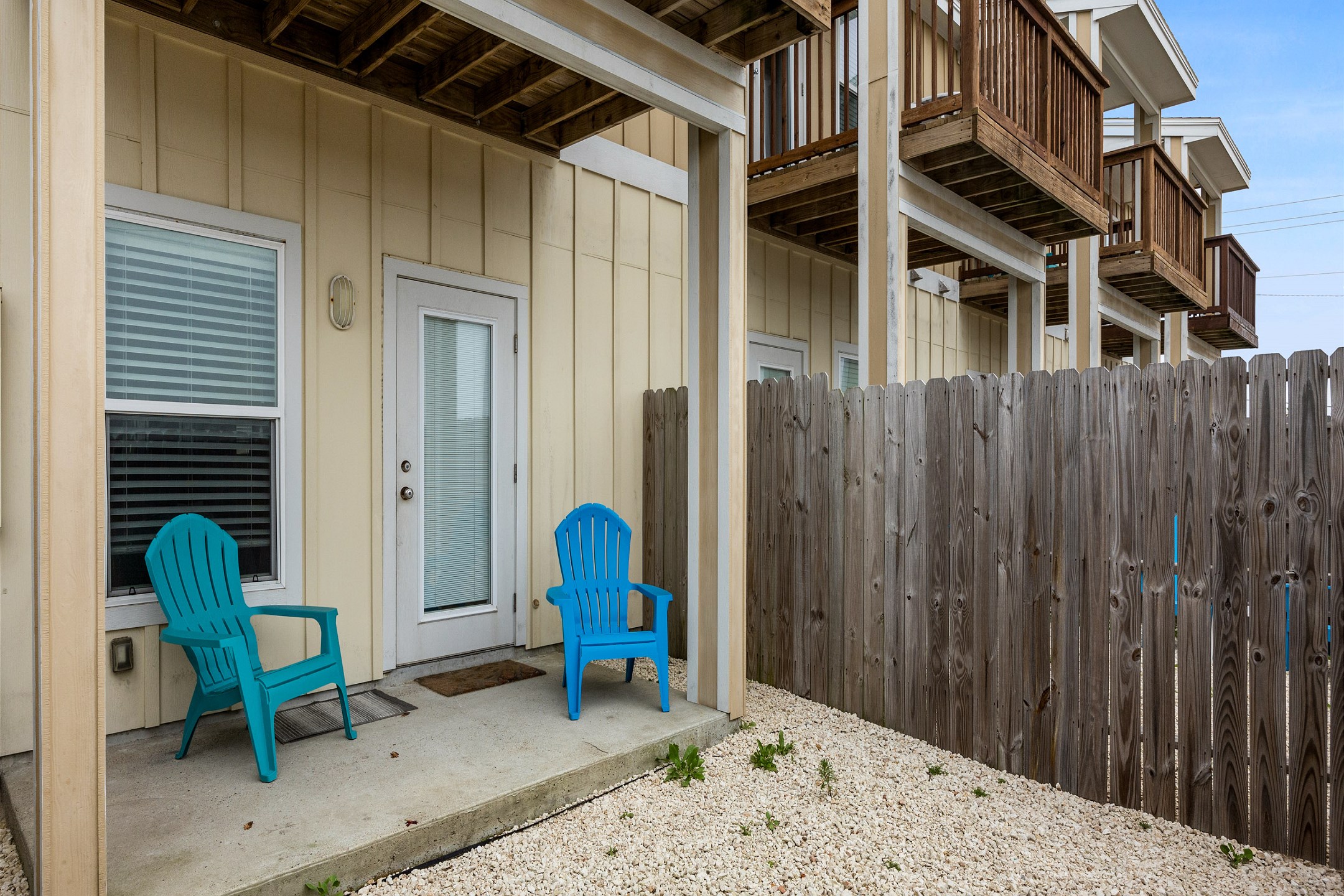 Private patio with seating for relaxing after a day in the sun 