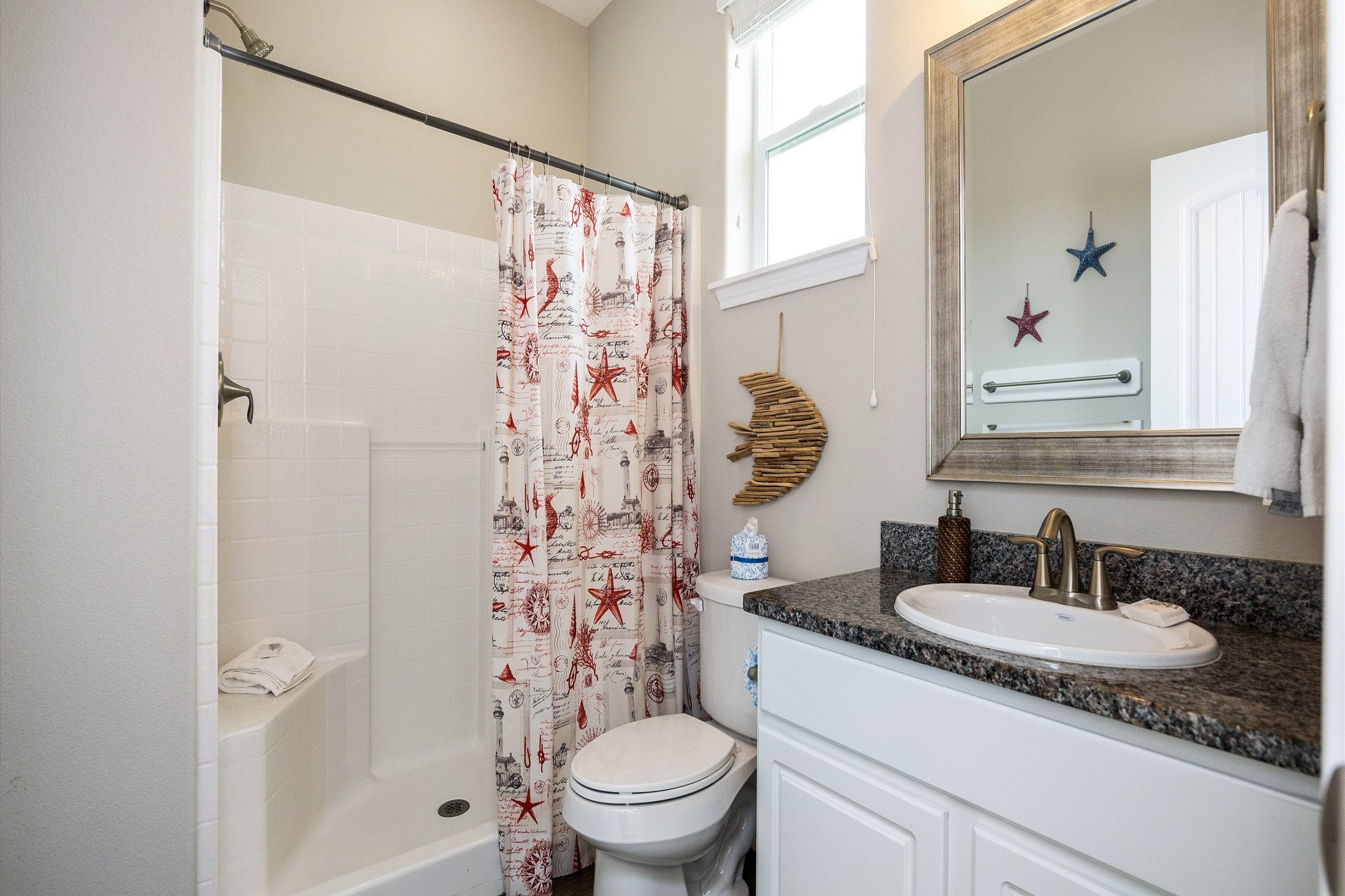 Second guest bathroom on the second floor with sink and walk in shower 