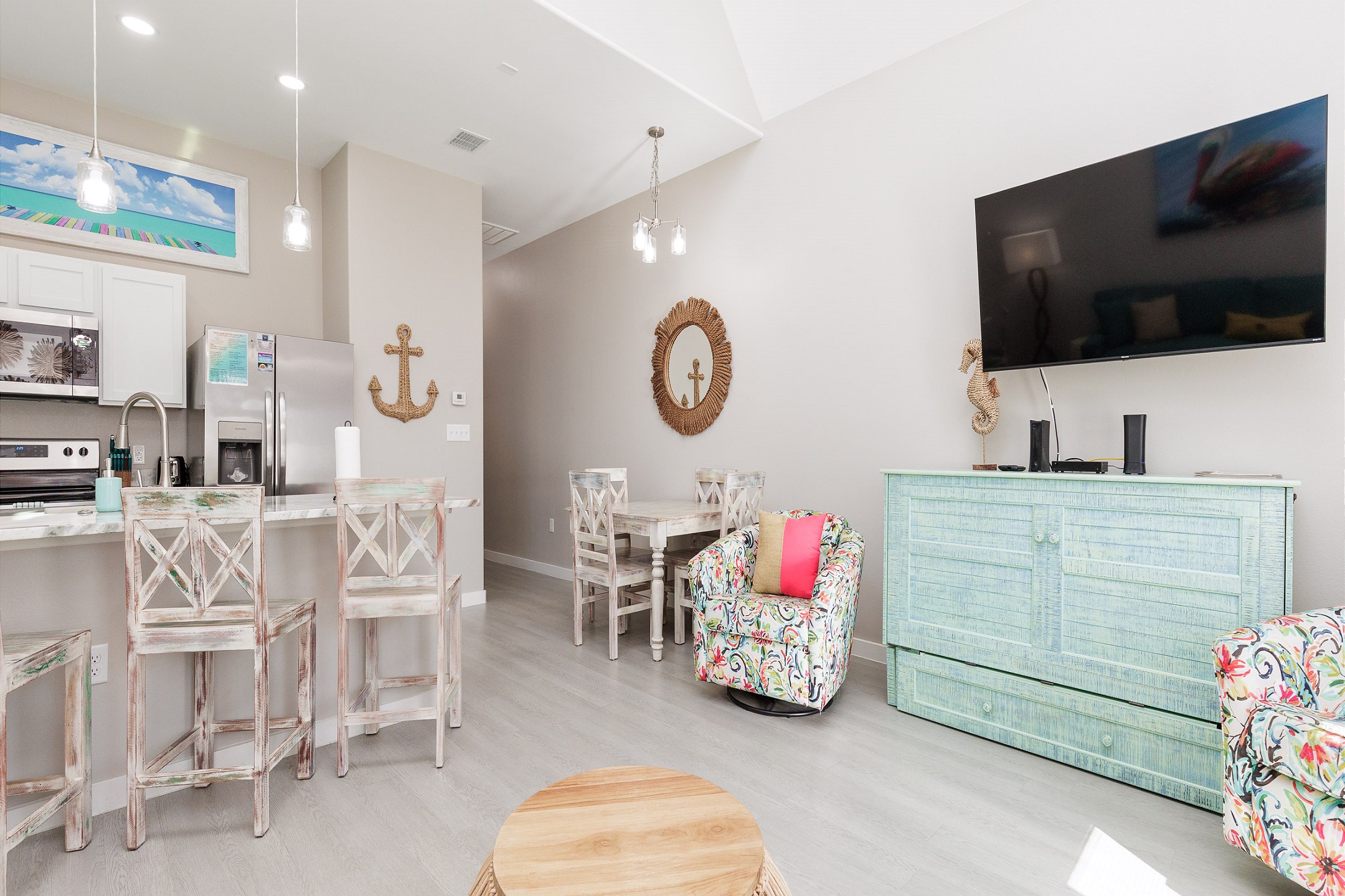 Spacious living, dining and kitchen area with a queen credenza that pulls out