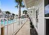 Front entrance to the property with a pool view 