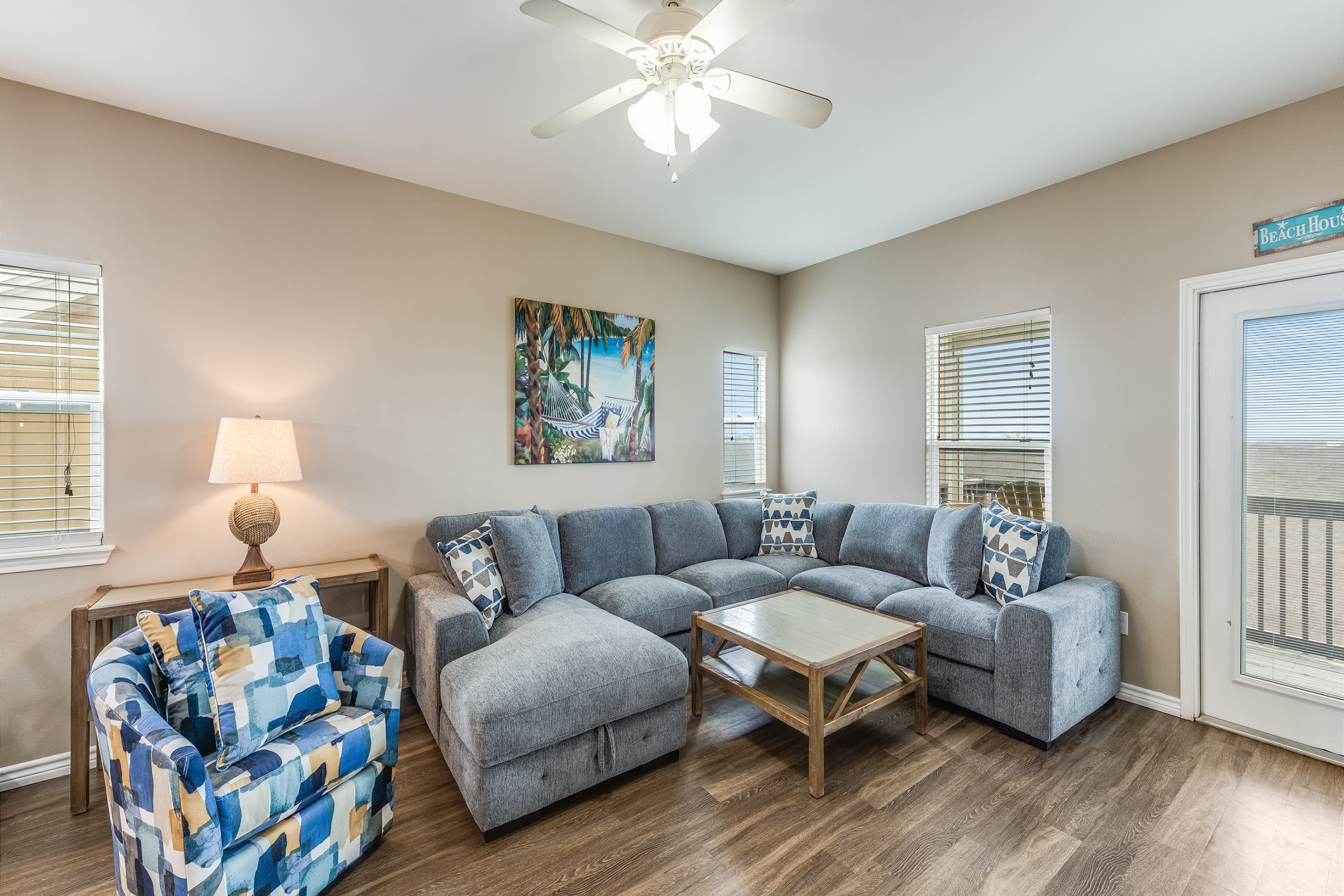 Cozy living space on the third floor with a new sectional and accent chair to relax on during your vacation