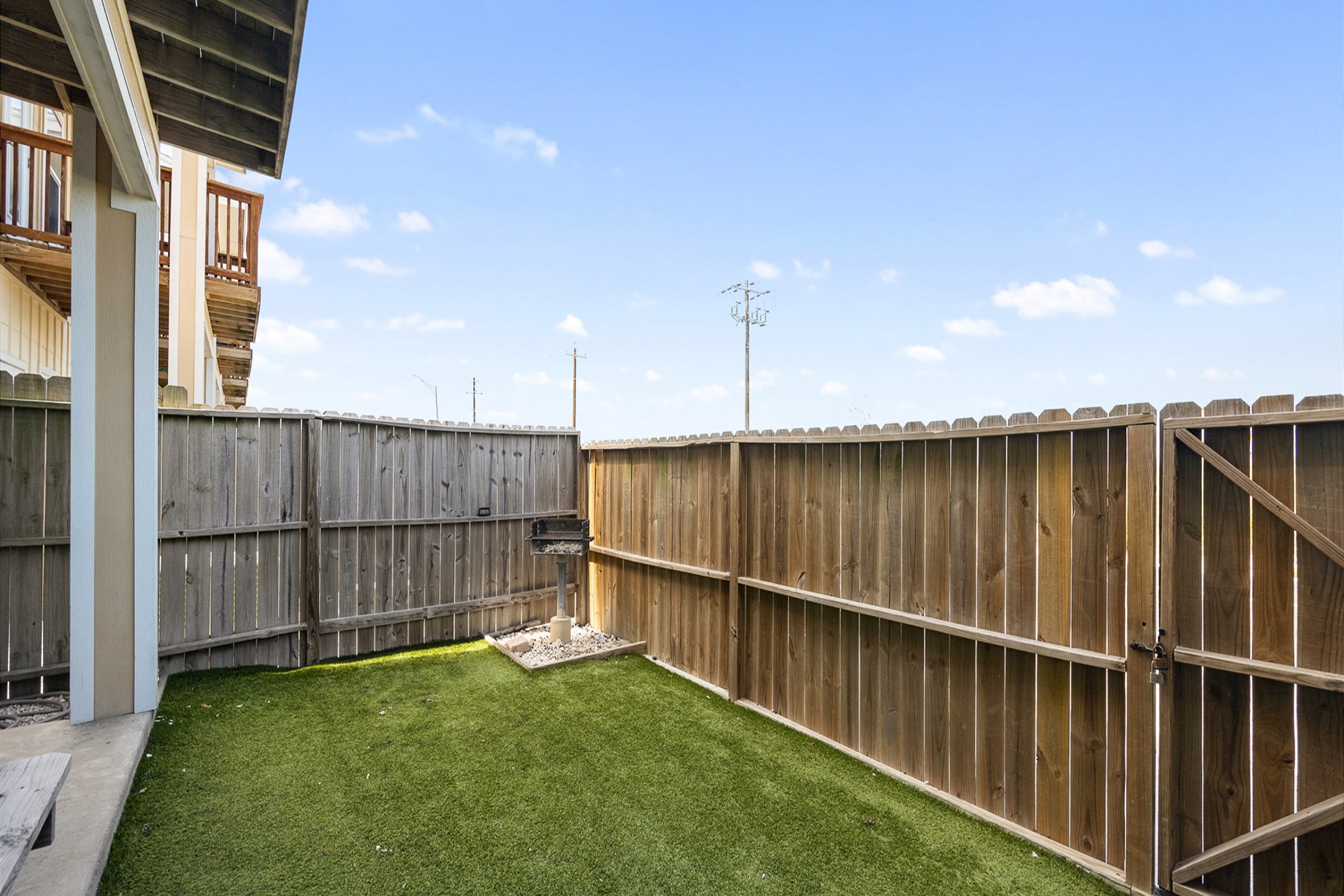 Back, fenced in patio area off the master bedroom
