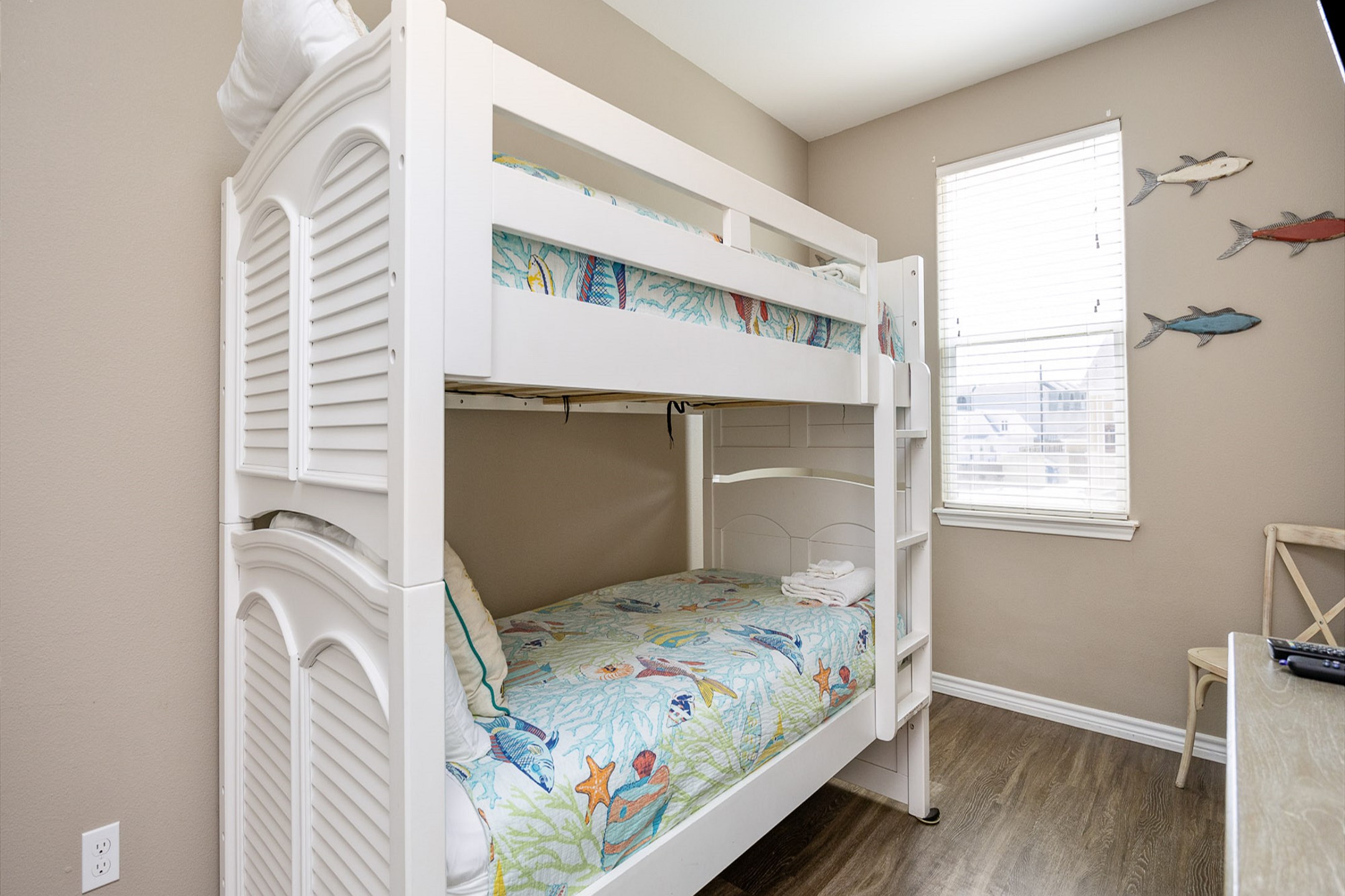 Fourth bedroom on the second floor with twin over twin size bunk bed, shared bathroom and flat screen TV