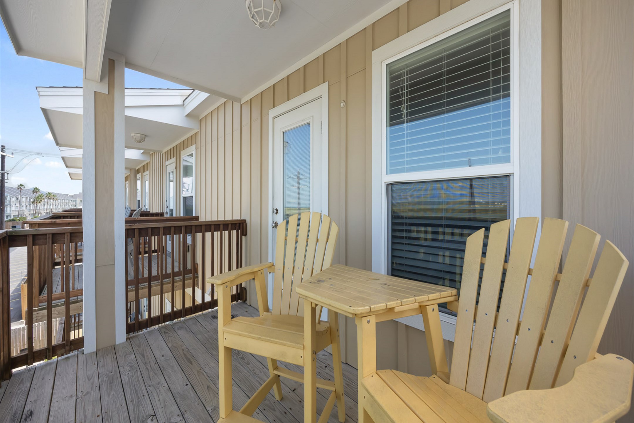 Third floor balcony off the living area with comfortable seating 