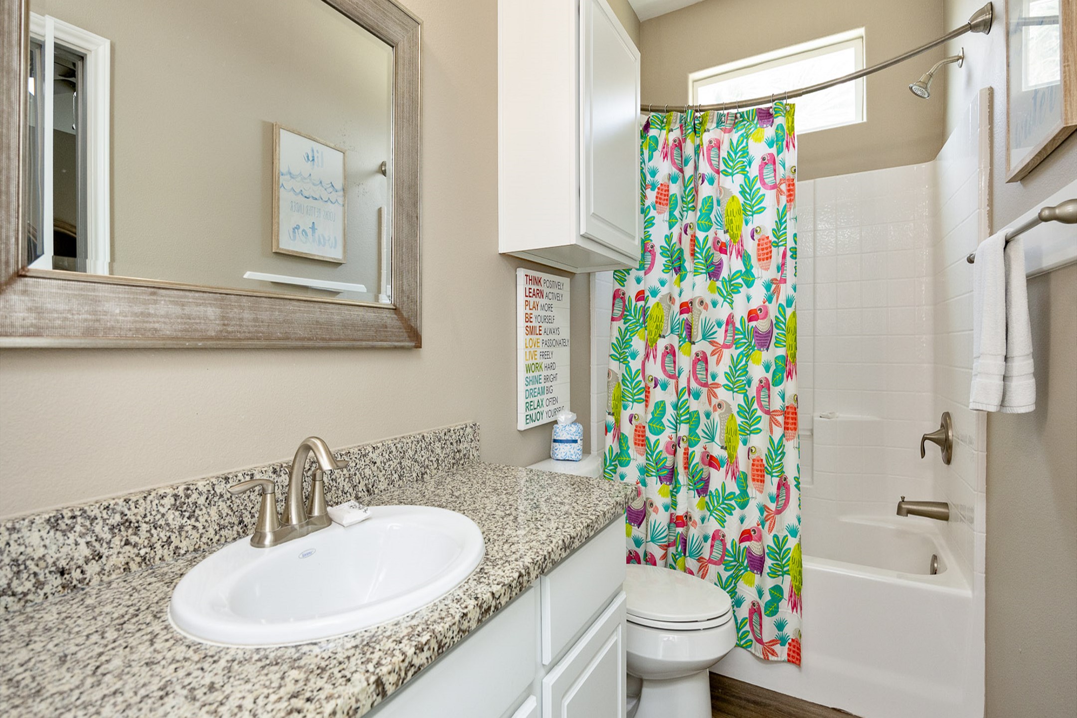 Guest bathroom on the second floor with tub/shower combo that is shared from the third and fourth bedrooms