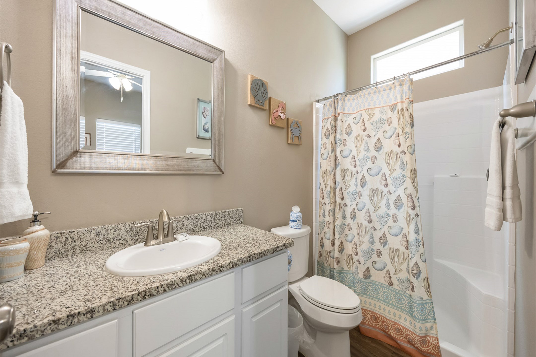 Private bathroom off the second bedroom on the second floor with walk in shower