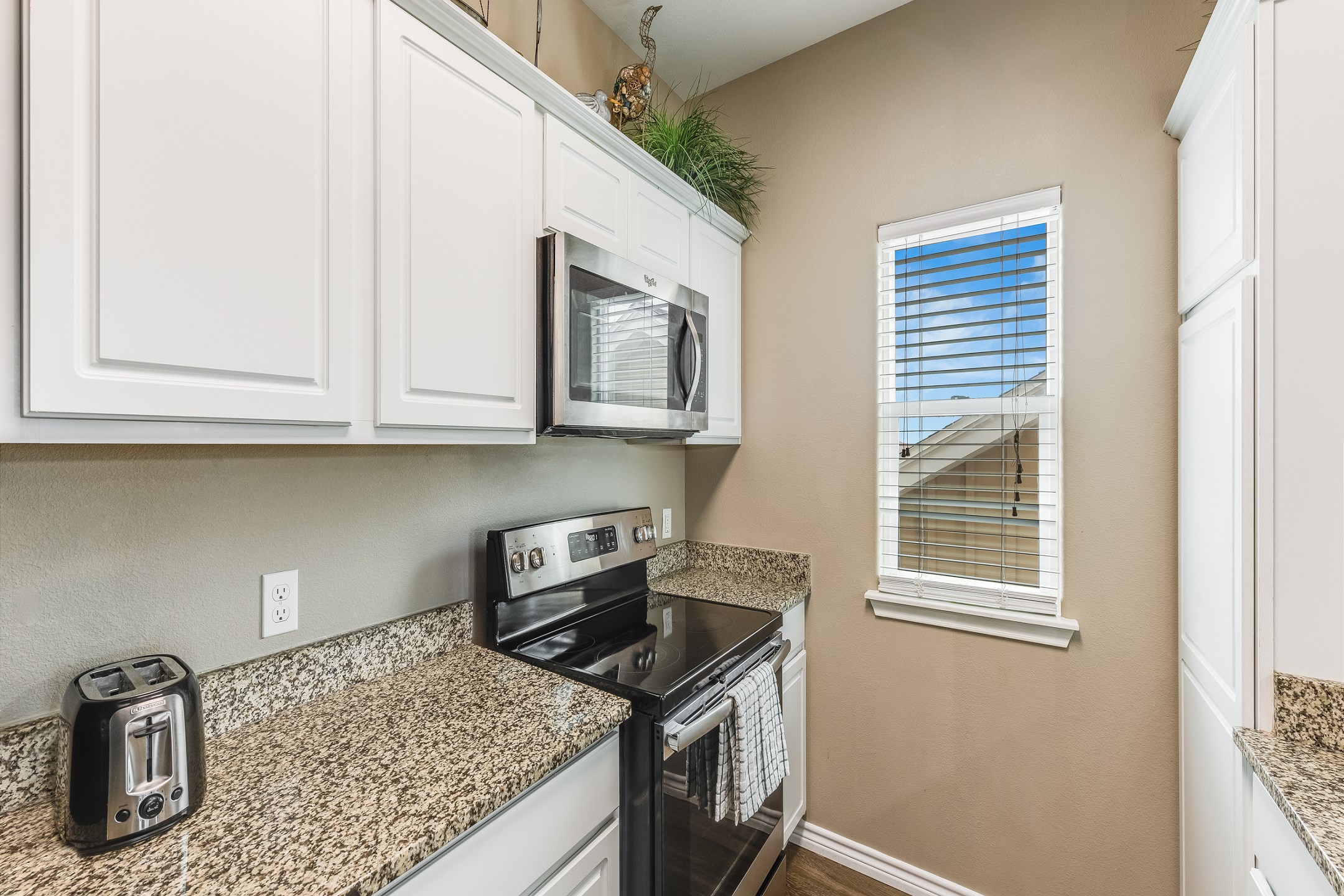 Modern kitchen on third floor with stainless steel appliances 