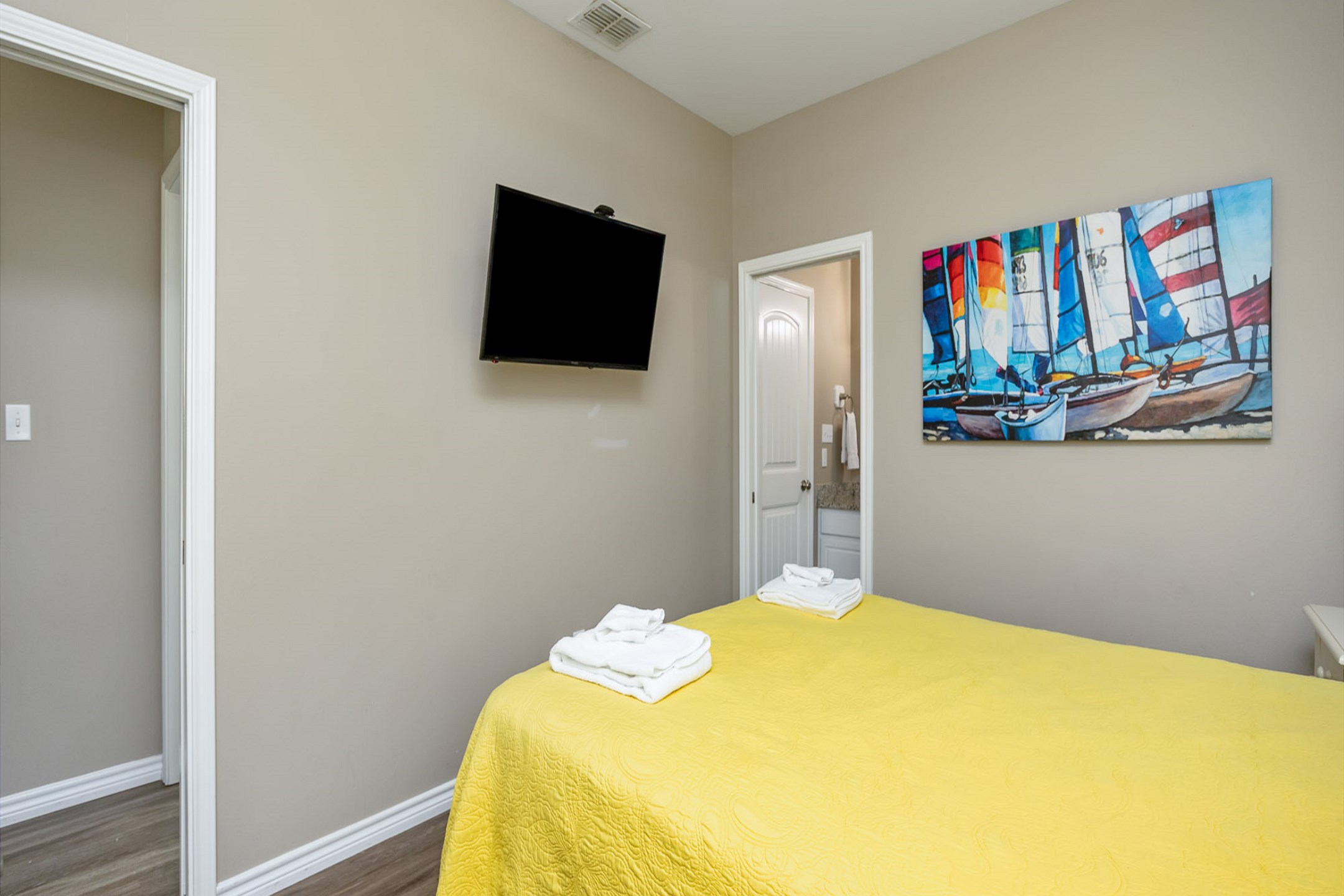 Third bedroom on the second floor with queen size bed, shared bathroom, private balcony and flat screen TV