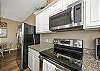 Modern kitchen on third floor with stainless steel appliances 