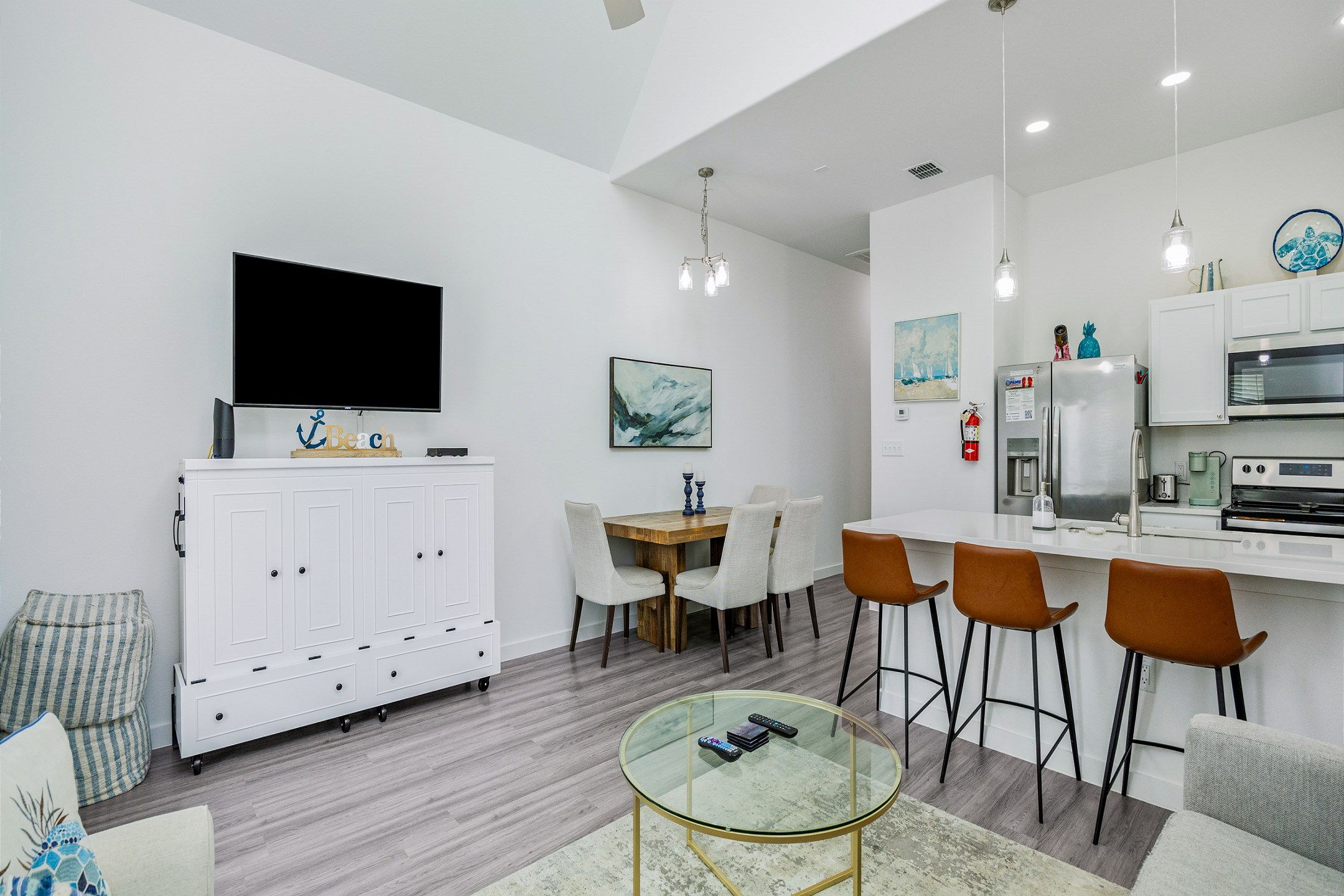 Expansive social hub with a gourmet kitchen, formal dining area, and plush living room