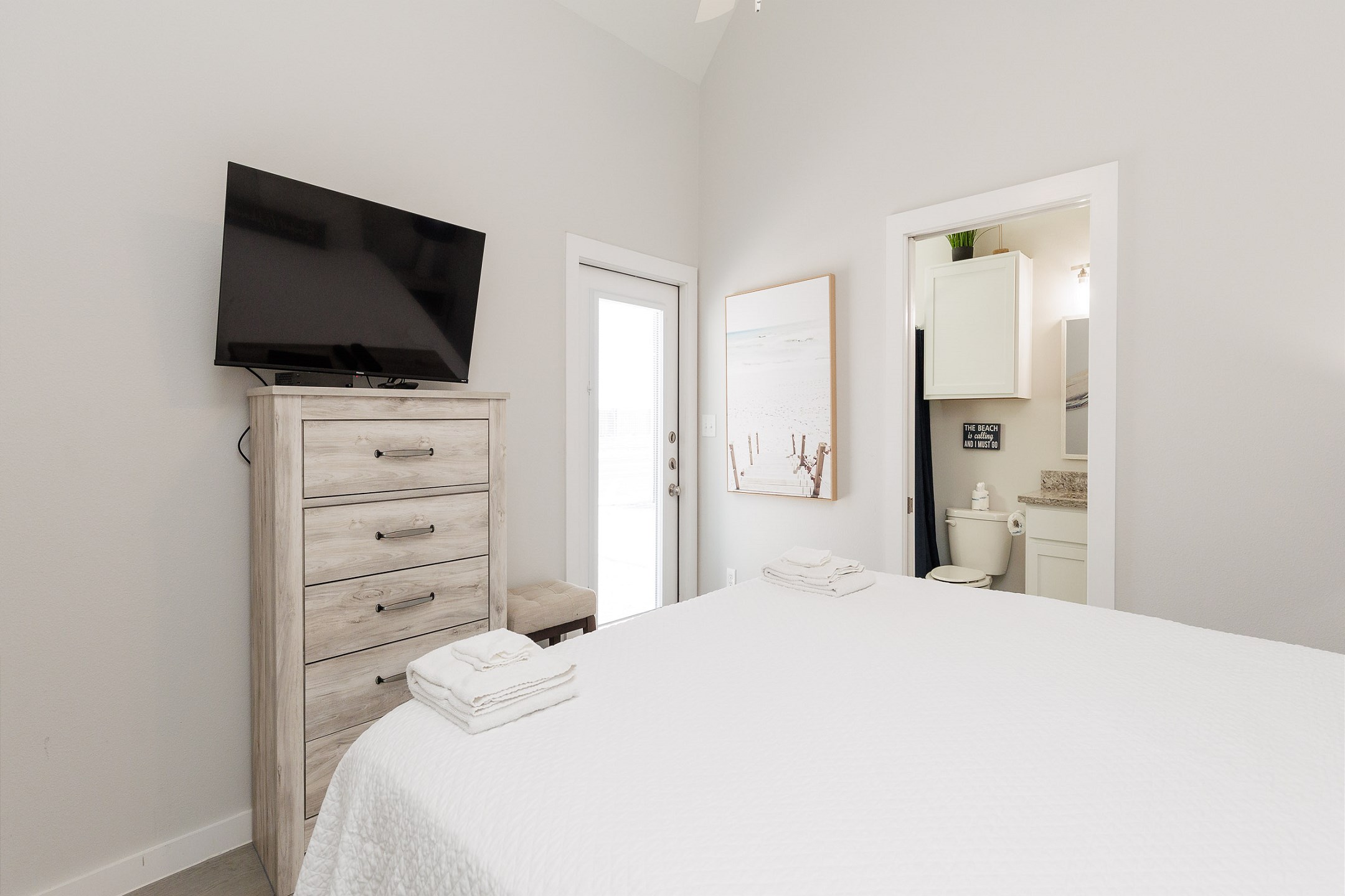 Master bedroom with king size bed, private bathroom and flat screen TV