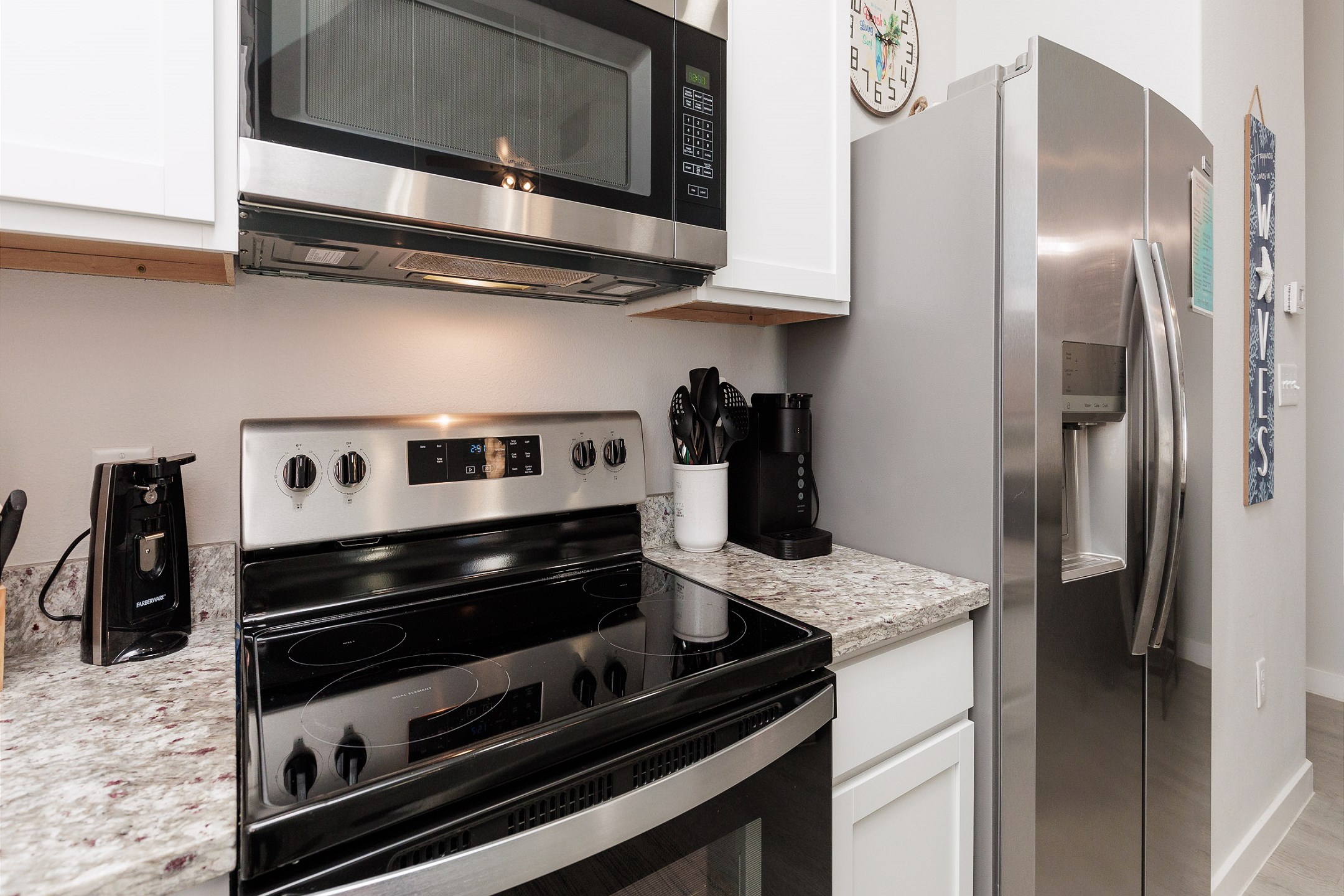 Fully stocked kitchen with stainless steel appliances 