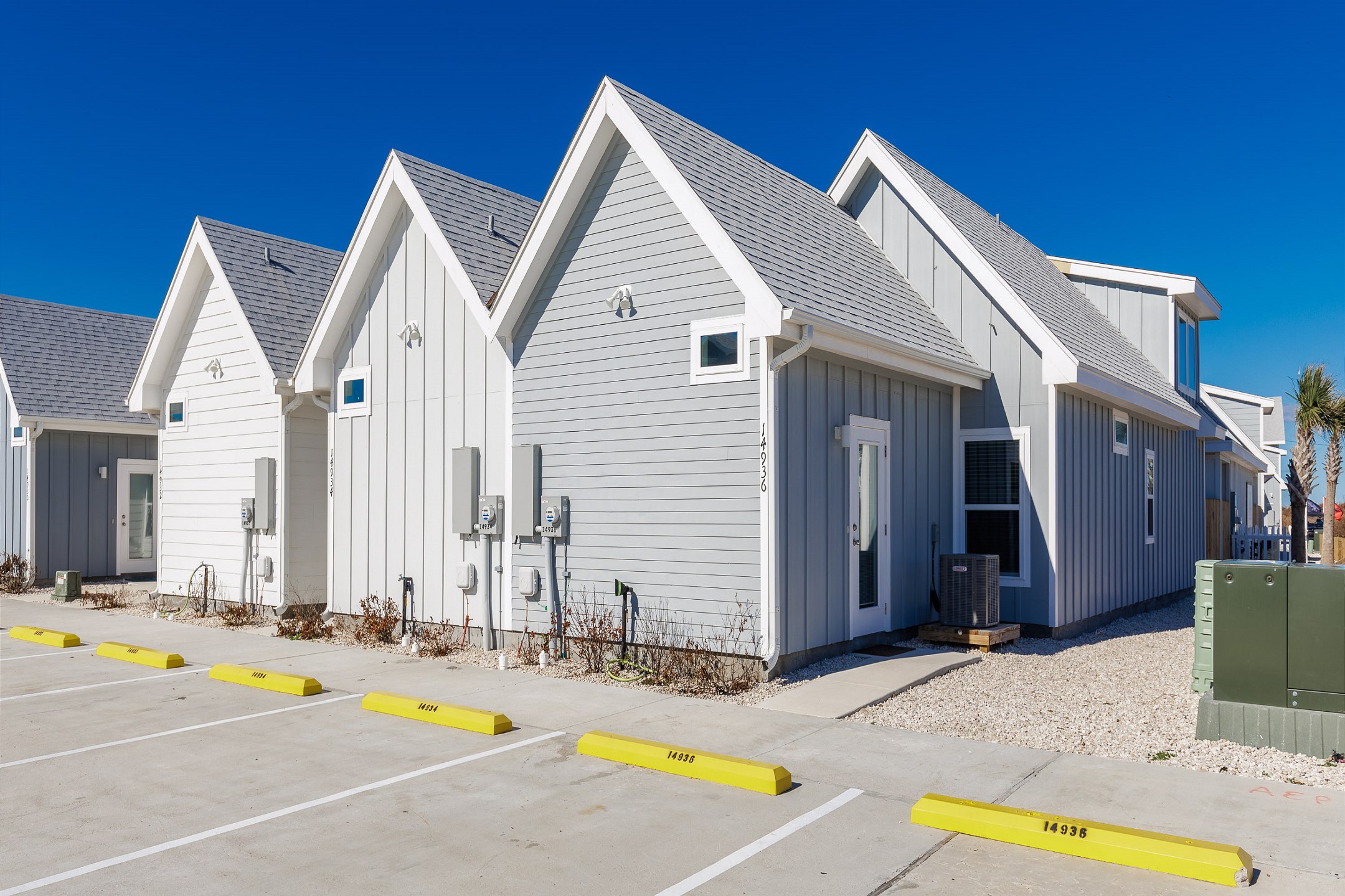 Back of property with two assigned parking spots 