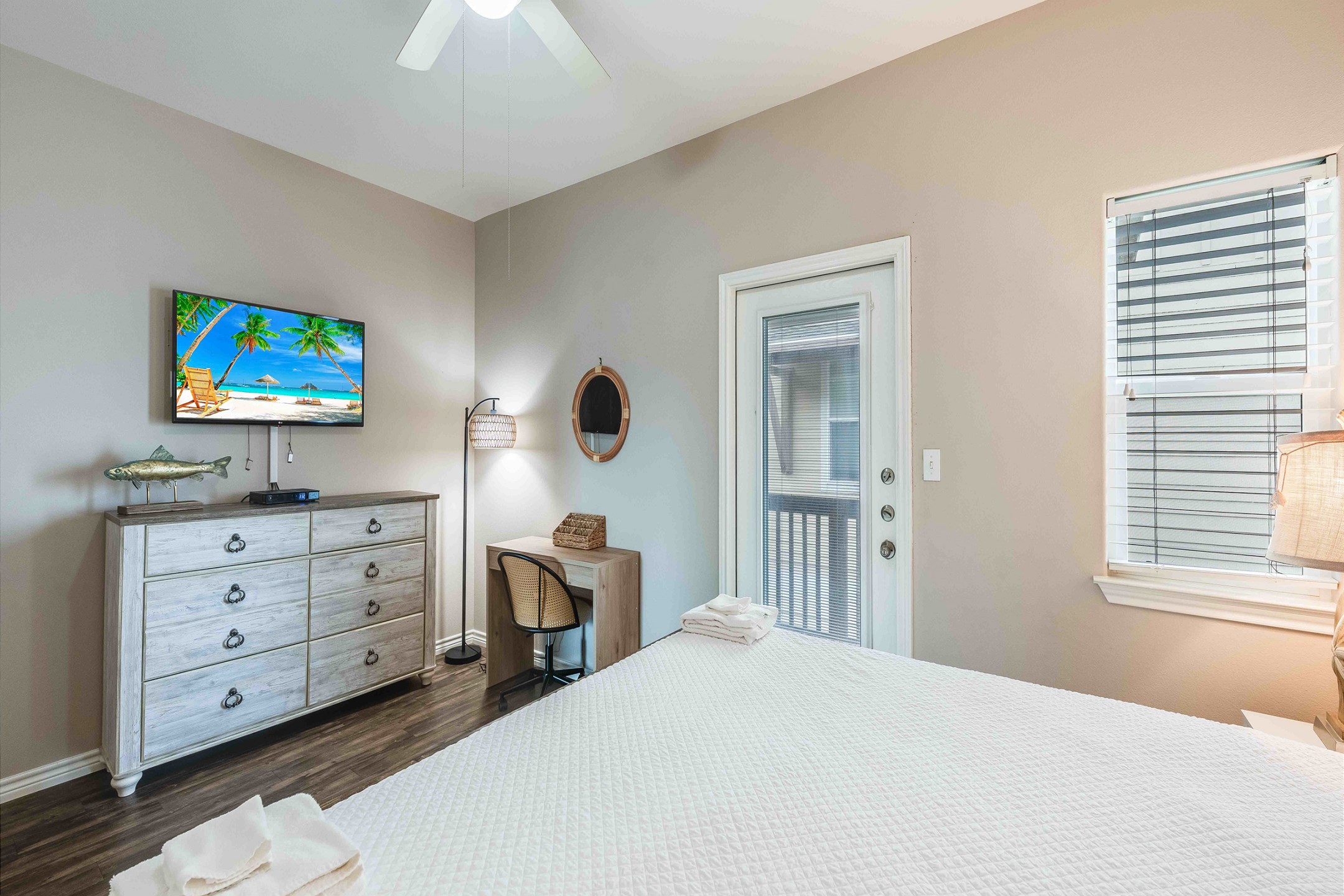 Master bedroom on the second floor with a king size bed, ensuite bathroom, private balcony and flat screen TV