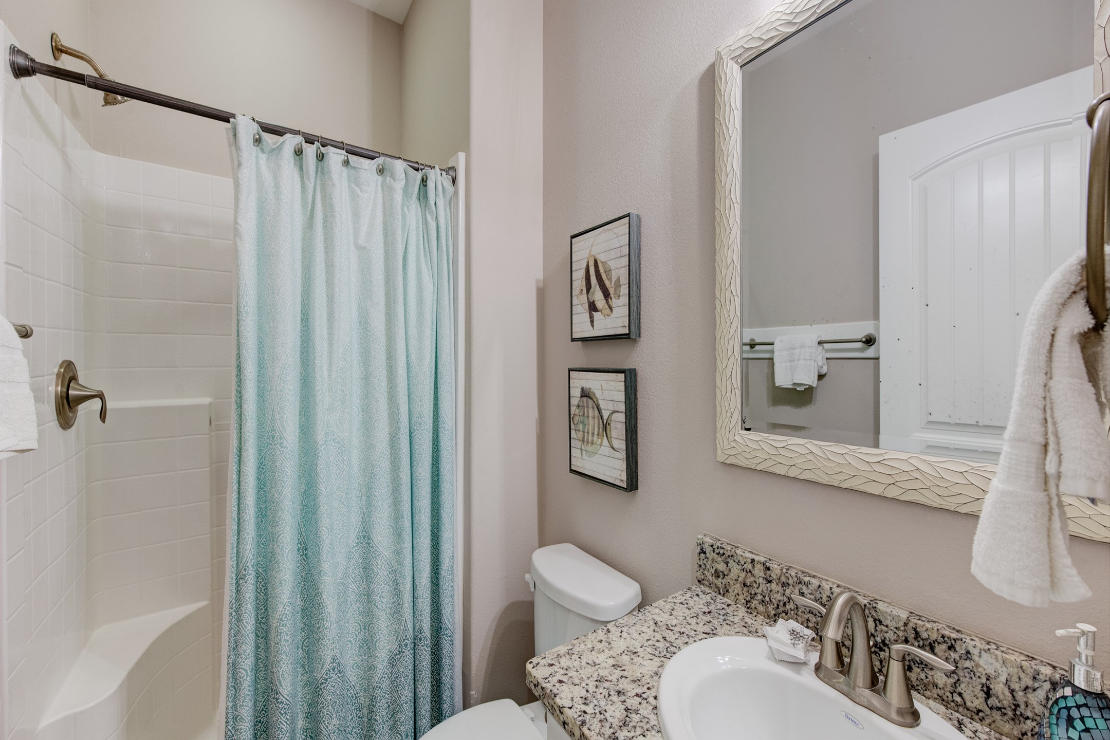 Guest bathroom on the second floor with single sink and walk in shower 