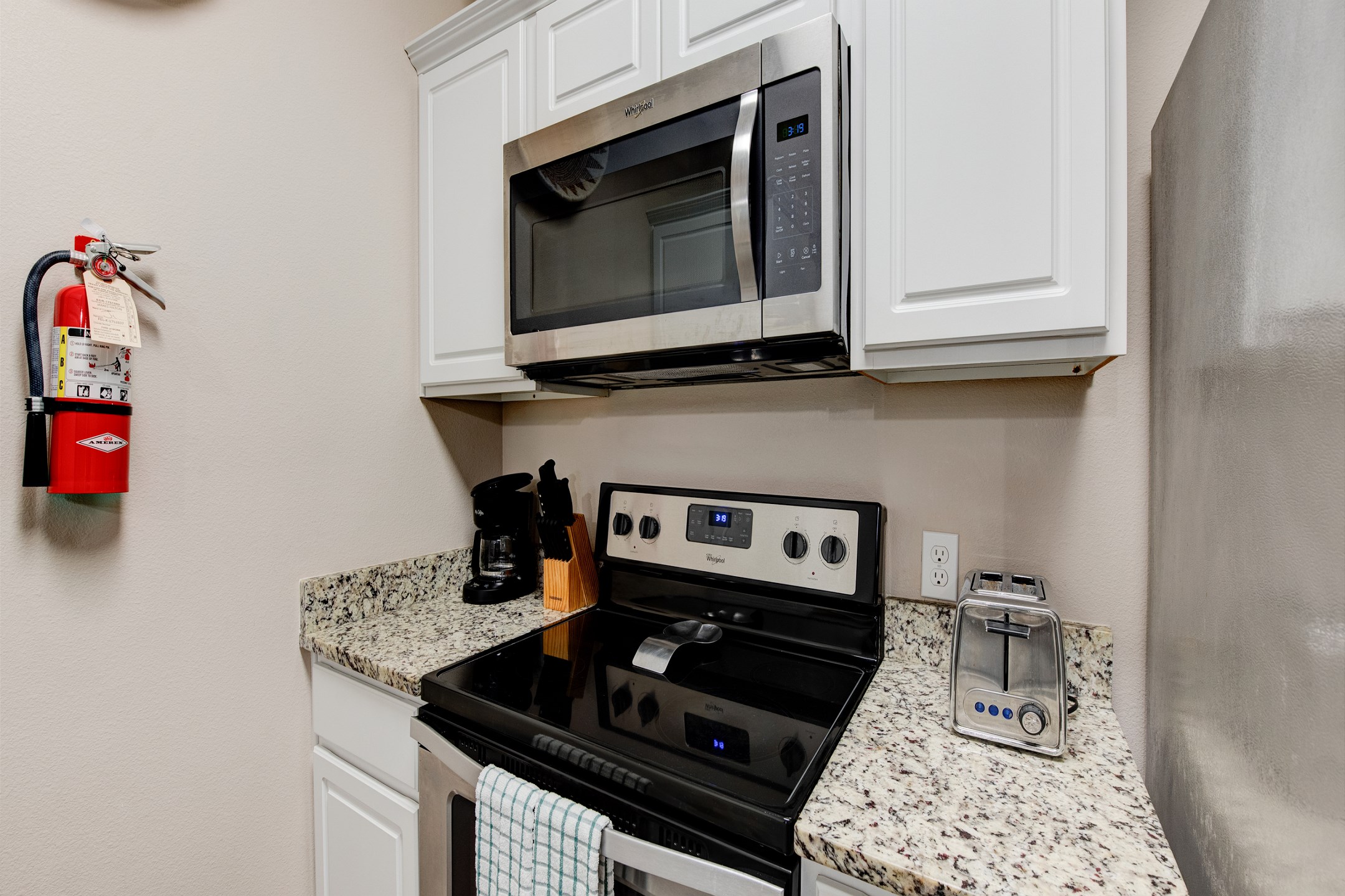 Fully equipped kitchen space with coffee maker, toaster, and other essentials provided