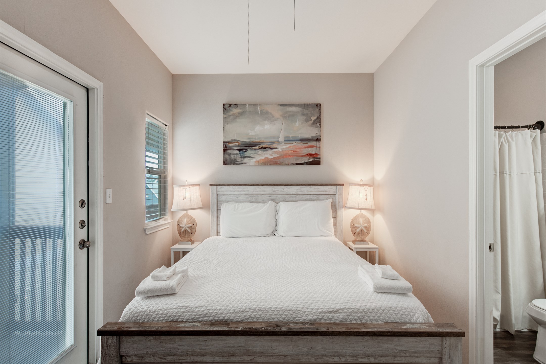 Master bedroom on the second floor with a king size bed, ensuite bathroom, private balcony and flat screen TV