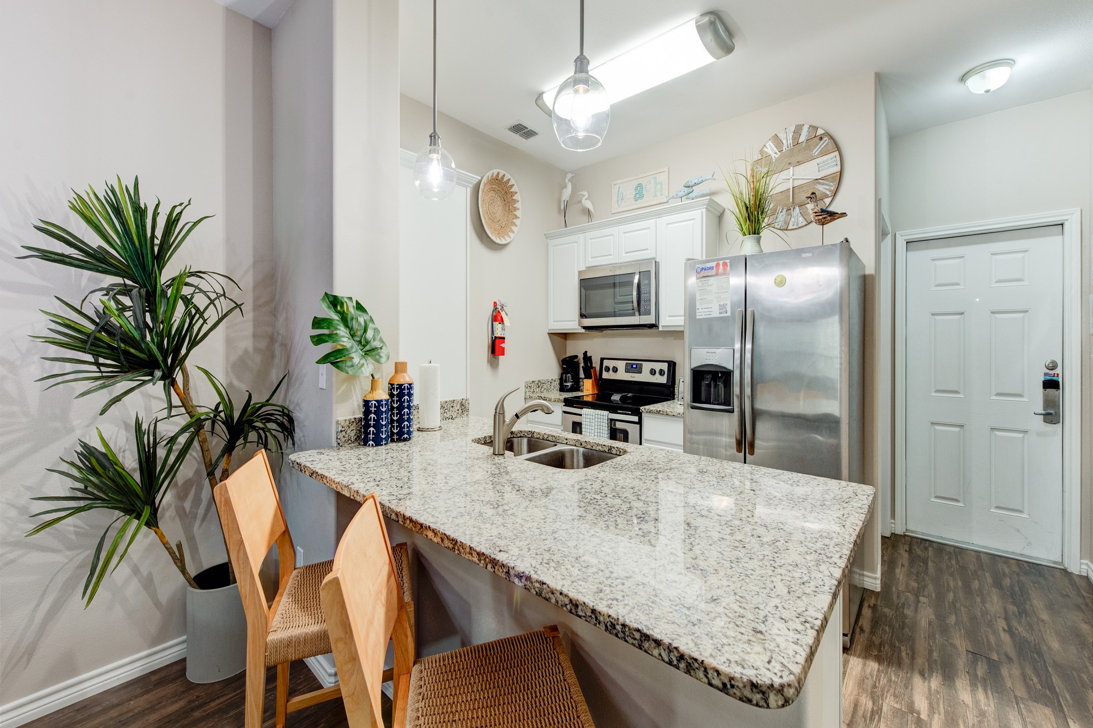 Kitchen and bathroom are conveniently located on the first floor - The granite breakfast bar, with seating for three, is perfect for casual meals or entertaining